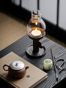 レトロな中国風の古い岩の泥の日本式は古い燭台の茶道の茶のテーブルをまねて飾って飾って日本式の茶道の粗い陶器のろうそくの燭台を飾っています。