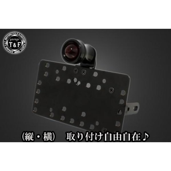 SN04325 ガレージT&F サイドナンバーキット&ルークテールランプ(ブラック)+ステー グラストラッカースズキ グラストラッカー(全年式)【本体の仕様】 ・素材:スチール製。 ・カラー:ブラック仕上げ。 【テールランプ取り付けステーの仕様】 ・素材: スチール製。 ・カラー:ブラック仕上げ。 【配線の役割】 ・赤色:ブレーキランプ(+)。 ・青色:ポジションランプ(+)。 ・黒色:アース(-)。 ※製造ロットによってテールランプの配線の色、長さが変更されることがございますので予めご了承ください。 【製品の特徴】 ・通常のサイドナンバーKITでは縦固定か横固定のみですが、本製品は縦横どちらにも対応。あなたのバイクスタイルに合わせた自由なレイアウトが可能です。 ・取り付けステーの角度調整や前後スライド調整が出来る為、ナンバープレートの位置を思い通りにセッティング可能。細部まで理想のスタイルを実現します。 ・横向きの場合:7か所の取り付け位置を選択可能。 ・縦向きの場合:12か所の取り付け位置を選択可能。 ・車種専用のステー付きです。加工不要で取り付け可能。 ガレージT&F製フラットフェンダーKITと同時装着される場合はサイドナンバーオフセットKITを同時にお買い求め下さい。 【注意事項】 ・ガレージT&F製サイドナンバーKITは取り付け位置にかなり自由度がございます。しかしながらテールランプの種類によっては取り付け位置が制限される場合がございます。 ・ガレージT&F製フラットフェンダーKITと同時装着する場合も取り付け位置が制限される場合がございます。 ・車種によっては、別売のサイドナンバーオフセットKITが必要となる場合がありますのでご注意ください。 ・装着イメージは画像は全てドラッグスター400となります。取り付される車種によって多少イメージが異なる場合がございます。予めご了承下さい。 商品の改良や生産工程の変更により掲載されている仕様やデザインが予告なく変更される場合がございます。 SN04325楽天 JP店