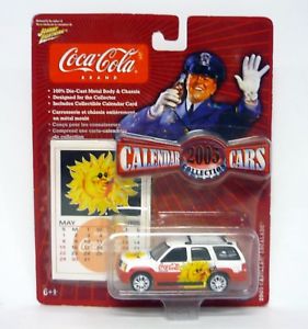 【送料無料】模型車　モデルカー　スポーツカー　johnny lightning 2003 cadillac escalade calendar cars diecast moc 2004