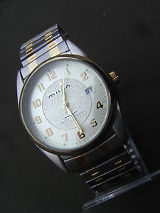 milan mln 905,harmonieuse montre masculine a guichet date dorigine usa 1987