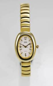【送料無料】kathy ireland watch women stainless steel gold stretch water resist white quartz