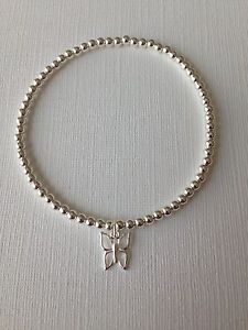 yzuXbg@ANZT?@X^[OVo[r[YnhChXgb`uXbgsterling silver beaded stretch childs bracelet with butterfly charm handmade