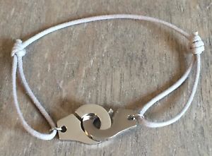 ブレスレット　アクセサリ—　コットンコードグレーシルバースチールブレスレットthe current bracelet handcuffs on cotton cord adjustable grey silver steel