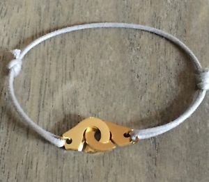 ブレスレット　アクセサリ—　グレーコードグレースチールゴールドブレスレットhandcuffs on grey cotton cord adjustable grey steel gold bracelet child