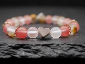 yzuXbg@ANZT?@KXr[YsNuXbgelastic bracelet with glass beads and heartrosegold pink