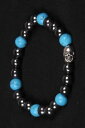 yzuXbg@ANZT?@w}^Cg^r[YSr[YuXbg^[RCYEhhematite and turquoise round with skull metal bead rubber beaded bracelet