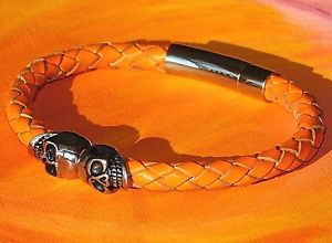 yzYuXbg@cCXJIWU[CxCA[gXeXXeB[uXbgtwin skull orange braided leather amp; stainless steel bracelet by lyme bay art