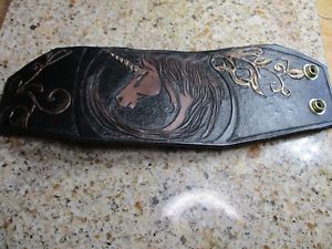 yzYuXbg@AU[jR[JtnhJbgj[NU[A[greal leather unicorn cuff, hand cut tooled, unique, leather art