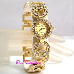 【送料無料】腕時計　デザイナーダブルウォッチスワロフスキークリスタルキスladies gold plated designer dress double kiss bling watch w swarovski crystals