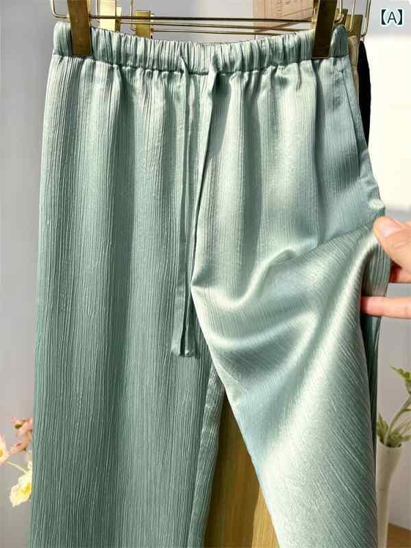 パンツ レディース ワイドパンツ 光沢の ある ゴールドの 素材の ワイド レッグ パンツ 春夏に ぴったりの 韓国 ドレープ 感の アセテート サテンの ホーム ストレート カジュアル パンツ。