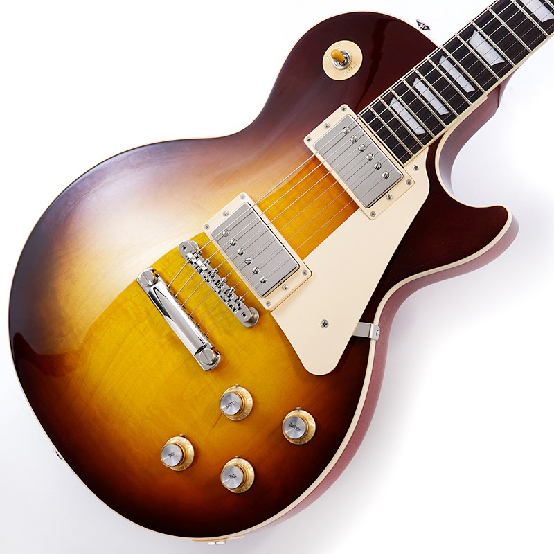 Gibson Les Paul Standardギブソンの定番モデル「レスポール・スタンダード」が入荷！コチラは、AAフィギュア・メイプルトップやスリムテーパーのネックシェイプを採用した60's仕様採用モデルです。ウエイトリリーフを施さないソリッドボディに、握りやすいスリムテーパーのネックをジョイント。キャビティはトラディショナルモデルと同様に、基盤を使わず配線されており、コンデンサーはオレンジドロップが使われております。サウンドの要であるピックアップには、バーストバッカー61R&バーストバッカー61Tを搭載。芯のあるクリーントーンはもちろん、歪ませても骨太でバランスの良いドライブサウンドを奏でてくれます。ギブソン王道のロックサウンドを求めるギタリストには是非ともオススメの1本です。是非この機会をお見逃しなく！＜SPEC＞BODY.....AA Figured Maple Top / Solid Mahogany BackNECK.....MahoganyPROFILE....Slim TaperFINGERBOARD.....Rosewood / 22FHARDWARE.....NickelKNOBS.....Gold Top Hats with Silver Reflector & PointersBRIDGE.....ABR-1 Tune-O-Matic & Aluminum Stop BarMACHINEHEAD.....Grover Rotomatics w/ Kidney ButtonsPICKUP.....Burstbucker 61R (R) & Burstbucker 61T (T)CONTROL.....2Volume-2Tone-3way Toggle SW【SN.203430094／Weight≒4.46kg】■専用ブラウン・ハードケース付属イケベカテゴリ_ギター_エレキギター_Gibson_Les Paul Models_新品 JAN:4580228786963 登録日:2023/06/25 エレキギター ギブソン レスポール