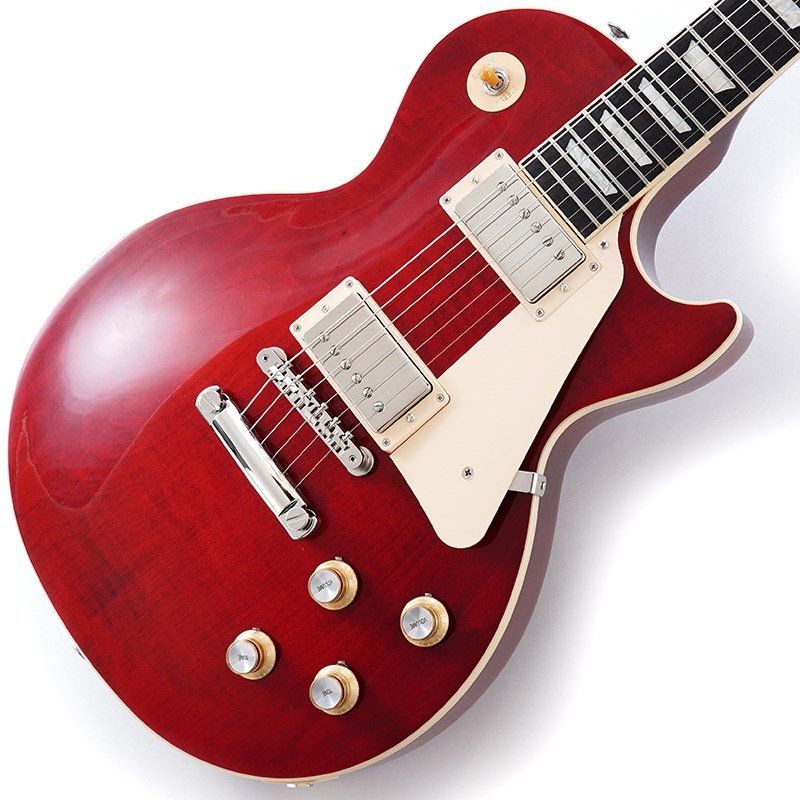 Gibson Les Paul Standard '60s Custom Color SeriesCustom Color Seriesは、1960年代のギブソンのクラシカルなカスタムカラーと、近年のリミテッドランに採用された人気カラーからインスピレーションを得て誕生したモデルであり、ギブソンファンの皆様に、エキサイティングなカラーのレスポール・スタンダードをお届けします。ギブソンの定番モデル「レスポール・スタンダード」が入荷！コチラは、AAフィギュア・メイプルトップやスリムテーパーのネックシェイプを採用した60's仕様採用モデルです。ウエイトリリーフを施さないソリッドボディに、握りやすいスリムテーパーのネックをジョイント。キャビティはトラディショナルモデルと同様に、基盤を使わず配線されており、コンデンサーはオレンジドロップが使われております。サウンドの要であるピックアップには、60s Burstbuckerを搭載。芯のあるクリーントーンはもちろん、歪ませても骨太でバランスの良いドライブサウンドを奏でてくれます。ギブソン王道のロックサウンドを求めるギタリストには是非ともオススメの1本です。是非この機会をお見逃しなく！Weight≒4.31kg専用ブラウン・ハードケース付属BodyMaterial: MahoganyTop: AA Figured MapleWeight Relief: NoneBinding: Single-ply Top and FretboardNeckNeck: MahoganyProfile: Slim TaperNut width: 1.695 / 43.05mmFingerboard: Indian RosewoodScale length: 24.75 / 628.65mmNumber of frets: 22Nut: Graph TechInlay: Acrylic TrapezoidsHardwareBridge: ABR-1 Tune-O-MaticTailpiece: Aluminum Stop BarTuners:Grover Rotomatics w/ Kidney ButtonsPlating:NickelElectronicsNeck pickup: 60s BurstbuckerBridge pickup: 60s BurstbuckerControls:2 Volumes， 2 Tones & Toggle Switch (Hand-wired with Orange Drop Capacitors)イケベカテゴリ_ギター_エレキギター_Gibson_Les Paul Models_新品 JAN:4570155996061 登録日:2023/10/27 エレキギター ギブソン レスポール