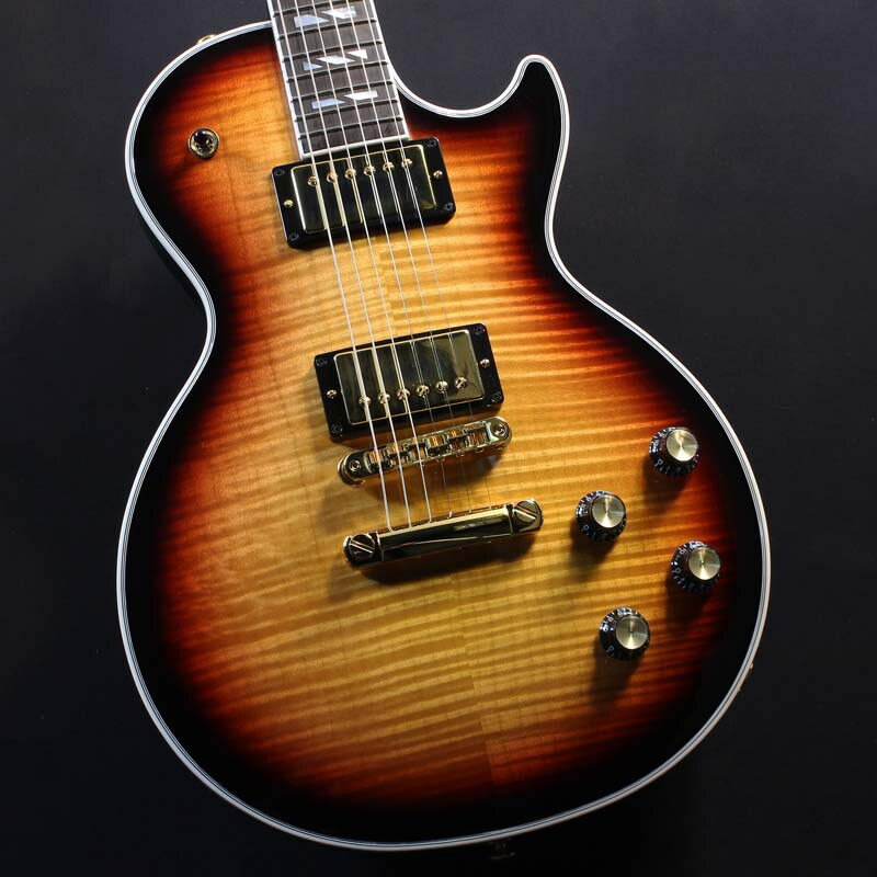 「最高」を意味するシュプリームと名付けられたUSAレギュラー最高峰モデル「Les Paul Supreme 」過去何度か生産されてきた「Les Paul Supreme 」がデザイン＆機能をリフレッシュして復活致しました。伝統的なレスポールの仕様を残しつつも高級感を演出する豪華な装飾、現代的な演奏性を追求する機能的な仕様の数々など、「最高」の名に相応しいモデルに仕上がっております。ボディトップには杢目の美しいAAAフィギュアド・メイプル、ボディバックにはウルトラ・モダン・ウェイト・リリーフが施されたマホガニーボディの仕様となっており、音響特性を考え抜かれたウェイト・リリーフ（重量軽減処理）が施されることで、伝統的なレスポール・サウンドと外観はそのままにボディを軽量化しております。マホガニー・ネックの指板はスーパースプリット・ブロック・マザー・オブ・パール・インレイで装飾されたエボニー指板、ヘッドストックにはギブソンのアーカイブから発見された1940年代のデザインにインスパイアされた新しいデザインのマザー・オブ・パールのインレイが施されており、ギブソンの伝統的な上位モデルらしさを感じる豪華な仕様となっております。指板のコンパウンド・ラジアスとハイポジションへのアクセスを高めたモダン・コンタード・ヒールの採用により、高い演奏性を実現しております。搭載のピックアップはBurstbucker ProとBurstbucker Pro＋の組み合わせとなっております。ボリュームとトーン・ノブのプッシュ/プル・スイッチによりコイルタップ、フェイズ、ピュアバイパスの切り替えが可能となり、幅の広いサウンドバリエーションを生み出すことで幅の広いジャンルに適応することが出来ます。美しい外観と優れた機能美を持つ現代的なレスポールの最高峰モデルを是非お試し下さいませ！！Body Style：Les PaulBody Shape：Les PaulBody Material：MahoganyTop：AAA Figured MapleBinding：Multi-ply Top and Headstock， Single-ply FretboardBody Finish：Gloss Nitrocellulose LacquerWeight Relief：Ultra ModernNeckProfile：SlimTaperScale Length：628.65 mm / 24.75 inFingerboard Material：EbonyFingerboard Radius：CompoundFret Count：22Frets：Medium JumboNut Material：Graph TechNut Width：43.053 mm / 1.695 inEnd Of Board Width：57.404 mm / 2.26 inInlays：Mother of Pearl Super Split BlockJoint：Glued In， with Modern Contoured HeelHardwareFinish：GoldBridge：Aluminum Nashville Tune-O-MaticTailpiece：Aluminum Stop BarTuning Machines：Locking Grover KeystonePickguard：Black 5-ply (Uninstalled)Truss Rod：AdjustableControl Knobs：Black Top Hat with Gold InsertSwitch Tip：BlackSwitch washer：NoneJack Plate Cover：GoldPickup Covers：GoldElectronicsNeck Pickup：Burstbucker ProBridge Pickup：Burstbucker Pro ＋Controls：2 Push/Pull Volume (Coil-Tap)， 2 Push/Pull Tone (Pure Bypass/Phase)Pickup Selector：3-way ToggleOutput Jack：1/4約4.01Kgハードケース付属イケベカテゴリ_ギター_エレキギター_Gibson_Les Paul Models_新品 JAN:4580568432247 登録日:2024/05/08 エレキギター ギブソン レスポール