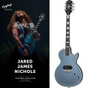 Jared James Nichols Blues Power Les Paul Customジャレッド・ジェイムズ・ニコルズ ブルース・パワー レスポール・カスタムは、ギブソン・ブランド・アンバサダーであり、偉大なるレス・ポール氏と同郷（ウィスコンシン州出身）のルーツを持つ気鋭のブルーズマンの最新シグネチャー・モデルです。ジャレッド・ジェイムズ・ニコルズ ブルース・パワー レスポール・カスタムは、クラシックなレスポール・カスタムのスタイリングと外観、そして見事なエイジド・ペルハムブルー・フィニッシュが特徴的です。艶消し加工されたニッケル・ハードウェア、Grover Locking Rotomaticチューナー、安定したチューニングを可能にするラップアラウンド・ライトニング・バーブリッジを搭載。ブリッジ・ポジションにはSeymour Duncan Jared James Nichols Signature JJN P90 Silencerピックアップを1基搭載し、生々しいトーンとハムノイズのない出力を実現しています。EpiLiteケースが付属となります。※画像はサンプルです。製品の特性上、杢目、色合いは一本一本異なります。BodyShape: Les PaulMaterial: MahoganyBinding: 7-ply Top， 5-ply Back and Headstock， Single Ply FretboardNeckNeck: MahoganyProfile: 50sNut width: 43mmFingerboard: EbonyScale length: 628.65mmNumber of frets: 22Nut: Graph Tech NuBoneInlay: Pearloid BlockHardwareBridge: Wraparound Lightning BarKnobs: Black Top Hats with Metal InsertsTuners: Grover Locking RotomaticPlating: Brushed NickelElectronicsBridge pickup: Seymour Duncan Jared James Nichols Signature JJN P90 SilencerControls:Master Volume， Master Tone; CTS Potentiometersギグケース付属イケベカテゴリ_ギター_エレキギター_Epiphone_ミュージシャンズ モデル_新品 JAN:4570155996580 登録日:2023/11/14 エレキギター エピフォン