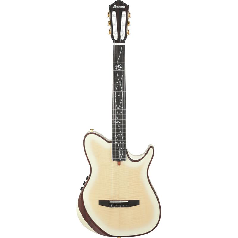 ■商品紹介Tim Hensonモデル新製品！2026年10月末頃順次入荷予定！・ギター・インスト・ジャンルをけん引し続けるバンド：Polyphiaのギタリスト、Tim Hensonモデル！・チェンバード構造のボディやFishmanのサウンド・システムを装備した新モデル・サイドポート（側面孔）を装備したFRシェイプ・チェンバード（くりぬき）構造ボディシングルカットのIbanezオリジナルFRシェイプを基に、サイド・サウンド・ポートを備えた独自のチェンバード（くりぬき）構造の薄型ボディです。この構造ならではの芯の有るサウンドとタイトな音色、さらに豊かな低音からクリアな高音まで驚くほど幅広い周波数特性を実現しています。TOPはシースルー・カラーでフィニッシュしたフレイム・メイプル材（合板）、クラシック・ギターでは一般的なファン・ブレーシングを備えています。・46mm幅ナット / 400mmR指板ナット幅は一般的なクラシック・ギターとエレキ・ギターの中間、指板には400mmのRを付けています。Timのようなエレクトリック・ギター・プレイヤーの演奏を想定し、スムーズなフィンガリングを実現するためにクラシック・ギターとは一線を画すスペックとしました。また、ナイロン・エレクトリック・ギターという新しいカテゴリを拓く本機は、バズ音すら厭わない（一般的なクラシック・ギターと比べると）やや低めの弦高設定を選択しています。・Tree of Death指板インレイIbanezを象徴する指板インレイと対を成すかのようなネーミングとデザインは、Tim本人の発想で実現したTODモデルを象徴する特別なスペックです。・Fishman Aura Custom Tim Henson System（プリアンプ＆ピックアップ）Fishman AuraテクノロジーとFishman Acoustic Matrix アンダーサドル・ピックアップを組み合わせたカスタム仕様のシステムです。ピックアップから得たサウンドからあたかもスタジオでマイク録音したようなレスポンスを生成し、両者をシームレスにブレンドすることで、鮮やかでナチュラルなアコースティック・サウンドを実現します。またステレオ出力機能により、ピエゾ・ピックアップとボディ・ピックアップの信号を1つの出力ジャックから独立して出力可能です。Auraのイメージ・ブレンド機能と組み合わせることで、ナチュラル且つアコースティックな深みのある、豊かで立体的なナイロン弦トーンを実現しています。（9Vアルカリ電池駆動）※画像はサンプルです。製品の特性上木目は一本一本異なります。■仕様詳細Body Shape：FRH chamberedTop：Flamed MapleBack & Sides：Solid Okoume back & Solid OkoumeBracing：Fan Bracing for Chambered FRH bodyBody binding：Rosewood body bindingNeck：C Shape / Nyatoh Set-in neckFretboard：EbonyBridge：Ebony double hole bridgeInlay：Tree of Death inlayTuning Machine：Gold Classical tunersNut Material：Plastic nutSaddle Material：Plastic saddlePickup：Fishman(R) Acoustic Matrix Undersaddle Pickup， Fishman(R) Bridge Mounted Body PickupPreamp：Fishman(R) Aura(R) Custom Tim Henson SystemOutput Jack：1/4 Output (Mono or Stereo)Scale :651mm/25.6NUT Width：46mmティム・ヘンソン シグネイチャーGigbag 付属検索キーワード：イケベカテゴリ_アコースティック・エレアコギター_エレガット_Ibanez_新品 SW_Ibanez_新品 JAN:4549763398826 登録日:2026/07/01 エレアコ アイバニーズ イバニーズ