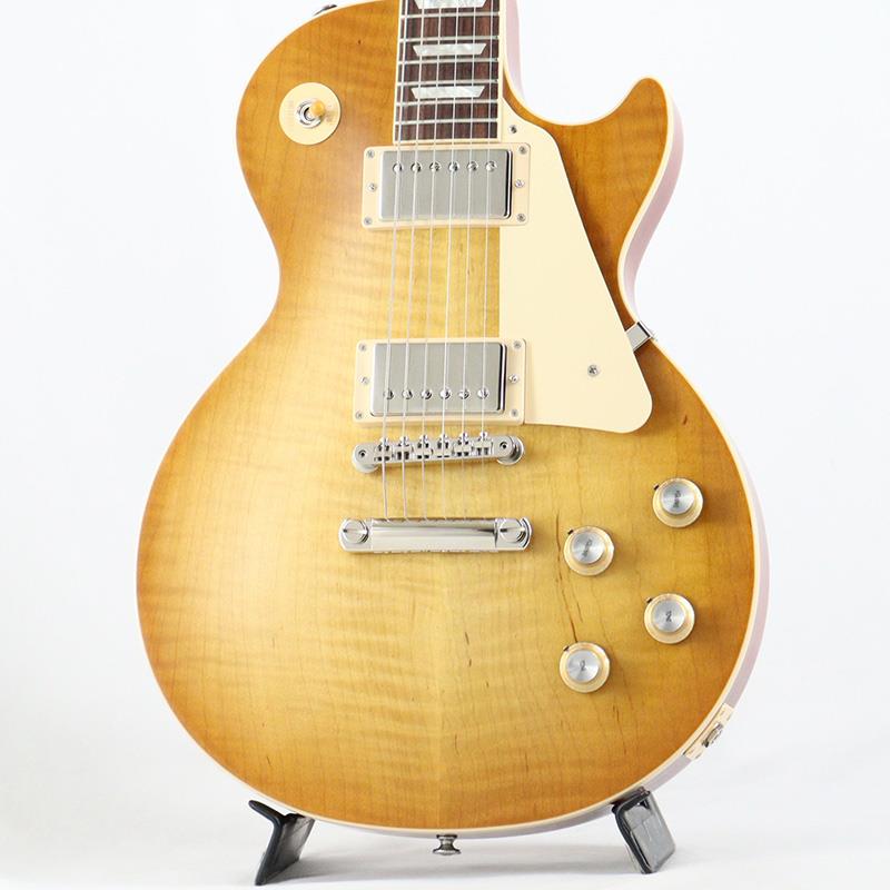 ■商品紹介Gibson Les Paul Standard '60sGibsonの定番モデル「Les Paul Standard '60s」が入荷！コチラは、AAフィギュア・メイプルトップやスリムテーパーのネックシェイプを採用した60's仕様採用モデルです。ウエイトリリーフを施さないソリッドボディに、握りやすいスリムテーパーのネックをジョイント。キャビティはトラディショナルモデルと同様に、基盤を使わず配線されており、コンデンサーはオレンジドロップが使われております。サウンドの要であるピックアップには、バーストバッカー61R&バーストバッカー61Tを搭載。芯のあるクリーントーンはもちろん、歪ませても骨太でバランスの良いドライブサウンドを奏でてくれます。ギブソン王道のロックサウンドを求めるギタリストには是非ともオススメの1本です。是非この機会をお見逃しなく！■仕様詳細Weight≒3.98kgBodyMaterial: MahoganyTop: AA Figured MapleWeight Relief: NoneNeckNeck: MahoganyProfile: Slim TaperNut width: 1.695 / 43.05mmFingerboard: RosewoodScale length: 24.75 / 628.65mmNumber of frets: 22Nut: Graph TechInlay: Acrylic TrapezoidsHardwareBridge: ABR-1 Tune-O-MaticKnobs: Gold Top Hats with Silver Reflector & PointersTuners: Grover Rotomatics w/ Kidney ButtonsPlating: NickelElectronicsNeck pickup: Burstbucker 61RBridge pickup: Burstbucker 61TControls: 2 Volumes， 2 Tones & Toggle Switch (Hand-wired with Orange Drop Capacitors)ハードケース付属検索キーワード：イケベカテゴリ_エレキギター_レスポールタイプ_Gibson_Les Paul Models_新品 SW_Gibson_新品 JAN:4580228786987 登録日:2025/12/19 エレキギター ギブソン レスポール