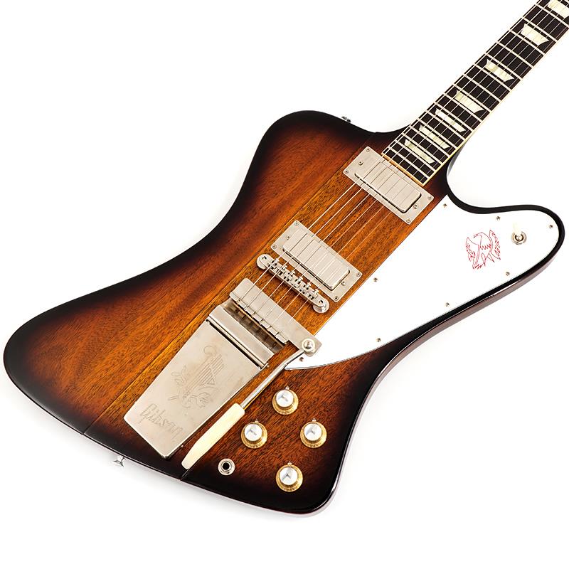 ■商品紹介長きに亘り培われた高い製作技術と飽くなき探究心、厳選されたマテリアルにより至高のエレキギター・ベースを製作するために1984年に立ち上げられたGibson Custom Shop。現在もなお昔ながらのハンドクラフト製法と、徹底的に追求したヴィンテージの知識から製作されたカスタムショップ・ラインナップは、他所の追従を許さないほどの見事な作りとなり、プレイヤーの内に秘めるインスピレーションを際限なく沸き立たせてくれる最高の愛機となるでしょう。 特徴的な9プライのマホガニー/ウォルナットによって構成されたスルーネックにウィングのマホガニーボディ構造、リバースアングルのペグラインにバンジョーペグなど、他のGibson製品とは一線を画す唯一無二の個性が光るFirebird V。所謂ミニハムバッカーとは異なるFirebird用のアルニコ5ピックアップはBluesやRock 'n Rollに最適な情熱的な切れ味を持ち合わせています。ピックガードに刻まれたエンブレムが削れて消えてしまう程にハードに弾き込んでいただきたい逸品です。S/N 503523Weight≒3.99kg■仕様詳細Body Material: 9-ply Mahogany/Walnut Neck-ThroughBinding: Fingerboard 1-Ply CreamWeight Relief: NoneFinish: Nitrocellulose Lacquer VOS (Vintage Patina)Neck Material: 9-ply Mahogany/Walnut Neck-ThroughProfile: Authentic 63 Medium C-ShapeScale Length: 24.75 / 628.65mmFingerboard Material: Indian Rosewood，Hide Glue FitFingerboard Radius: 12Number Of Frets: 22Frets: Authentic Medium-JumboNut Material: NylonNut Width: 1.69 / 42.85mmEnd of Board Width: 2.24 / 56.89mmInlays: Aged Cellulose Nitrate TrapezoidJoint: Neck-Through ConstructionHardware:Finish: NickelTuner Plating: NickelBridge: ABR-1Saddle Material: Nickel-plated BrassTailpiece: Maestro VibrolaTuning Machines: Deluxe Banjo TunersPickguard: 3-Ply White/Black/White Firebird Hot-stampedTrussRod: 2-way AdjustableTruss Rod Cover: Black 1-Ply Gibson Hot-stampedControl Knobs: Gold Top Hats w/ Silver InsertsSwitch Tip: CreamControl Covers: BlackStrap Buttons: AluminumPickup Covers: NickelNeck Pickup: Firebird Alnico VBridge Pickup: Firebird Alnico VControls: 2 500K CTS Volume Pots，2 500K CTS Tone Pots，Hand-Wired HarnessPickup Selector: 3-Way Switchcraftハードケース　認定書他　付属検索キーワード：イケベカテゴリ_エレキギター_ファイヤーバードタイプ_Gibson_Custom Shop_新品 SW_Gibson_新品 JAN:4580568413758 登録日:2025/10/06 エレキギター ギブソン カスタムショップ