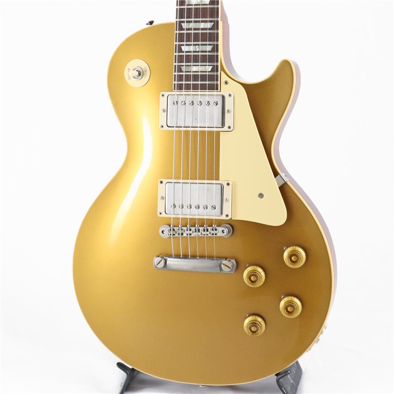 ■商品紹介預かり代行販売（委託品）雰囲気抜群のDouble Goldカラーを纏ったGibson Custom Shop 1957 Les Paul Standard VOSの2023年製中古品！長きに亘り培われた高い製作技術と飽くなき探究心、厳選されたマテリアルにより至高のエレキギター・ベースを製作するために1984年に立ち上げられたGibson Custom Shop。現在もなお昔ながらのハンドクラフト製法と、徹底的に追求したヴィンテージの知識から製作されたカスタムショップ・ラインナップは、他所の追従を許さないほどの見事な作りとなり、プレイヤーの内に秘めるインスピレーションを際限なく沸き立たせてくれる最高の愛機となるでしょう。1952年、Les Paul Model誕生以来、58年中期までラインナップされたGold Topカラー。スタンダードシリーズにおいて、58年以降になるとチェリーサンバーストを筆頭に様々なバーストが誕生致しましたが、俄然人気を誇るカラーで御座います。黄色味なインレイやエイジドされたニッケルパーツ、バンブルビー搭載などヴィンテージへの拘りが体現された至高の一本です。幾度と無くレシピがマイナーチェンジされているGibsonのGoldカラーですが、本機はまさにGold Top好きにはたまらないDouble Goldカラーとなり、黄色味と緑色味がバランスよく交わり、落ち着いた雰囲気を醸し出しております。ネックシェイプは1957 Les Paul王道のファットなネックシェイプではなく、Authentic ’59 Medium C-Shapeがセレクトされておりますので、より握り込みもし易く、プレイアビリティも良い仕様！新たにバンブルビータイプのペーパーオイルコンデンサーとヴィンテージカーブを追及した500KのCTSポットを装備したことで、Volume・Tone共に絞りはじめの変化量が緩やかになっていますので、手元のコントロールだけで繊細かつ自在にニュアンスを変化させることができます。＊ネック折れの為、ヘッド裏に当て木をしたネック折れリペア痕有り。ヘッドトップのシルクスクリーンの変更（オリジナルではございません。）ヘッドバックの下側に強度を保つ為の突板取り付けを行っております。（ロゴとシリアルはオリジナルとなります。）綺麗に修復されており現状のご使用やプレイアビリティには支障や問題はございません。突板を取り付けた関係上、1弦のポストは1巻しか出来ない状態にはなっております。チューニングやプレイアビリティには支障は無い状態ではございます。こちらの商品は、預かり代行販売中古品（委託中古品）に付き、現状コンディションでのお渡しとさせて頂きます。（中古保証はございません。ご了承の程、お願い申し上げます。）＊こちらの商品は、預かり代行販売中古品（委託中古品）に付き、現状コンディションでのお渡しとさせて頂きます。（中古保証はございません。ご了承の程、お願い申し上げます。）＊状態といたしましてフレットも部分的なへこみ等は見られず約9割以上残、トラスロッドの余裕も十分に確認しております。電気系統も良好となっており、VOSフィニッシュの元々の塗装やパーツの細かな傷、金属パーツのくもりなど以外は比較的使用感の少ない個体となっております。＊特に目立つ大きな傷等に関しましては写真をご参考ください。付属品オリジナルハードケース（鍵あり）、認定証、Pre Pack Checklist、ブランク・トグルスイッチ・プレート、シリアル入りタグ。※リユース店舗の取り扱い商品は中古の1点限りのご用意となります為、誠に勝手ながらご注文のお客様優先でのご案内とさせて頂きます。お問い合わせやお取置きのご依頼の際は予めその旨ご了承下さいますようお願い致します。イケベ楽器店Website以外の商品ページをご覧のお客様は、「取扱店舗の商品ページを見る」または「楽器店の購入ページへ」よりご注文下さい。■仕様詳細商品スペックBodyTop Material : 2-Piece Plain Maple， Hide Glue FitBinding Style : 1-Ply RoyaliteWeight Relief : NoneFinish : Nitrocellulose VOS (Vintage Patina)NeckNeck Material : Solid MahoganyNeck Profile : Authentic ’59 Medium C-ShapeScale Length : 24.75 / 62.865cmFingerboard Material : Indian Rosewood， Hide Glue FitFingerboard Radius : 12 / 304.8mmNumber of Frets : 22Frets : Historic Medium JumboNut Material : NylonNut Width : 1.687 / 42.85mmEnd-of-Board Width : 2.24 / 56.89mmInlays : Aged Cellulose Nitrate TrapezoidHardwareFinish : NickelBridge : No-Wire ABR-1Tailpiece : Lightweight Aluminum Stop BarTuners : Kluson Single Line， Single RingPick Guard : Laminated Cellulose Acetate ButyrateTruss Rod Cover : Authentic Stepped 2-PlyControl Knobs : Butyrate Gold Top HatsSwitch Tip : Amber CatalinSwitch Washer : Silkscreened Cellulose Acetate ButyrateJack Plate : Laminated Cellulose Acetate ButyrateElectronicsNeck Pickup : Custombucker Alnico III (Unpotted)Bridge Pickup : Custombucker Alnico III (Unpotted)Controls : CTS 500K Audio Taper Potentiometers， Paper-in-Oil CapacitorsWeight≒4.21kg検索キーワード：イケベカテゴリ_エレキギター_レスポールタイプ_Gibson_Custom Shop_ユーズド SW_Gibson_ユーズド JAN:2500010088251 登録日:2026/04/15 エレキギター ギブソン カスタムショップ