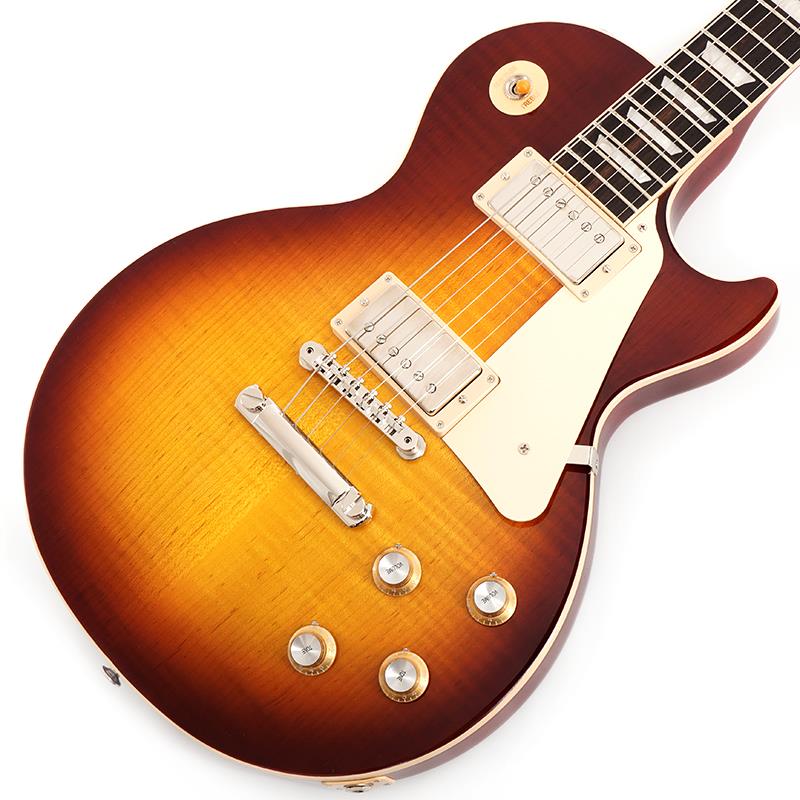 ■商品紹介Gibson Les Paul Standard '60sギブソンの定番モデル「レスポール・スタンダード」が入荷！コチラは、AAフィギュア・メイプルトップやスリムテーパーのネックシェイプを採用した60's仕様採用モデルです。ウエイトリリーフを施さないソリッドボディに、握りやすいスリムテーパーのネックをジョイント。キャビティはトラディショナルモデルと同様に、基盤を使わず配線されており、コンデンサーはオレンジドロップが使われております。サウンドの要であるピックアップには、バーストバッカー61R&バーストバッカー61Tを搭載。芯のあるクリーントーンはもちろん、歪ませても骨太でバランスの良いドライブサウンドを奏でてくれます。ギブソン王道のロックサウンドを求めるギタリストには是非ともオススメの1本です。是非この機会をお見逃しなく！S/N 230150034Weight≒3.94kg■仕様詳細BodyMaterial:MahoganyTop:AA Figured MapleWeight Relief:NoneNeckNeck:MahoganyProfile:Slim TaperNut width:1.695 / 43.05mmFingerboard:RosewoodScale length:24.75 / 628.65mmNumber of frets:22Nut:Graph TechInlay:Acrylic TrapezoidsHardwareBridge:ABR-1 Tune-O-MaticKnobs:Gold Top Hats with Silver Reflector & PointersTuners:Grover Rotomatics w/ Kidney ButtonsPlating:NickelElectronicsNeck pickup Burstbucker:61RBridge pickup Burstbucker:61TControls:2 Volumes， 2 Tones & Toggle Switch (Hand-wired with Orange Drop Capacitors)ハードケース付属検索キーワード：イケベカテゴリ_エレキギター_レスポールタイプ_Gibson_Les Paul Models_新品 SW_Gibson_新品 JAN:4580228786963 登録日:2026/05/14 エレキギター ギブソン レスポール