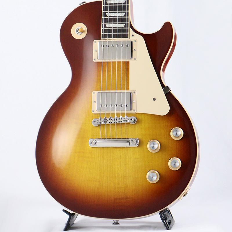 ■商品紹介B級アウトレットスペシャルプライス！Gibson Les Paul Standard '60sGibsonの定番モデル「Les Paul Standard '60s」が入荷！コチラは、AAフィギュア・メイプルトップやスリムテーパーのネックシェイプを採用した60's仕様採用モデルです。ウエイトリリーフを施さないソリッドボディに、握りやすいスリムテーパーのネックをジョイント。キャビティはトラディショナルモデルと同様に、基盤を使わず配線されており、コンデンサーはオレンジドロップが使われております。サウンドの要であるピックアップには、バーストバッカー61R&バーストバッカー61Tを搭載。芯のあるクリーントーンはもちろん、歪ませても骨太でバランスの良いドライブサウンドを奏でてくれます。ギブソン王道のロックサウンドを求めるギタリストには是非ともオススメの1本です。是非この機会をお見逃しなく！※本商品はB級特価品となります為、細かな擦り傷や、パーツのくすみが散見します。※掲載画像以外の外観瑕疵部分がある場合がございます。※保証に関しましてはプレイアビリティに関する点のみとなり、通常とは異なるアウトレット保証となります。■仕様詳細Weight≒4.13kgBodyMaterial: MahoganyTop: AA Figured MapleWeight Relief: NoneNeckNeck: MahoganyProfile: Slim TaperNut width: 1.695 / 43.05mmFingerboard: RosewoodScale length: 24.75 / 628.65mmNumber of frets: 22Nut: Graph TechInlay: Acrylic TrapezoidsHardwareBridge: ABR-1 Tune-O-MaticKnobs: Gold Top Hats with Silver Reflector & PointersTuners: Grover Rotomatics w/ Kidney ButtonsPlating: NickelElectronicsNeck pickup: Burstbucker 61RBridge pickup: Burstbucker 61TControls: 2 Volumes， 2 Tones & Toggle Switch (Hand-wired with Orange Drop Capacitors)ハードケース付属検索キーワード：イケベカテゴリ_エレキギター_レスポールタイプ_Gibson_Les Paul Models_アウトレット SW_Gibson_アウトレット JAN:2500010118842 登録日:2026/03/23 エレキギター ギブソン レスポール