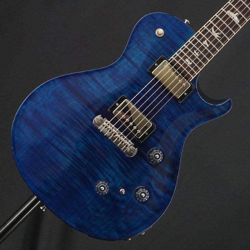 ■商品紹介Piezo ピックアップを搭載したシングルカットボディーのP245!お預かり代行販売にて中古品が入荷！レギュラーのカスタムが25スケールに対して、24.5スケールというミディアムスケールよりも短いスケールを採用し、更に特筆すべきはアウトプット・ジャックを2系統装備している点！それぞれのピックアップの出力を2台のアンプに振り分けたり、58/15、Piezoピックアップの出力をブレンドして出力することも可能！Paul自身が設計した58/15トレブル、ベースピックアップによりビンテージ・スタイルを周到しながら、クリアーでレンジの広いサウンドを出力！コイルタップも可能な為幅広いジャンルで活躍できます！当個体状態といたしましては、ボディ全体にほのかなスレキズ、弾きキズ、うち傷、ハードウェアのくすみさびが御座いますプレイヤーズコンディションとなっております。フレットは7割程度の高さを残し、ネックコンディションやトラスロッド、電装系含め演奏面で問題はございません！まだまだ末永くお付き合いいただける1本としてお迎えいただけます。この機会に是非ご検討ください！オリジナル・ハードケース付属バードタグ欠品Weight≒3.86kg■仕様詳細Body: Flame Maple / MahoganyNeck: MahoganyFingerboard:RosewoodConstruction:Set-neckFret: 22FNut:PRSRadius: 10inchScale:24.5Control: Volume(Magnet)、Volume(Piezo)、Tone(P/P Coil Split)、3way PU Selector(Magnet)、Output Selector(Magnet/Mix/Piezo)Pickups: PRS 58/15 SetMachine head: Phase III Locking TunerBridge: PRS Piezo Adjustable Stoptail検索キーワード：イケベカテゴリ_エレキギター_その他_P.R.S._PRS CORE MODELS (Custom／McCarty)_ユーズド SW_P.R.S._ユーズド JAN:2500010088251 登録日:2026/03/11 ギター ピーアールエス