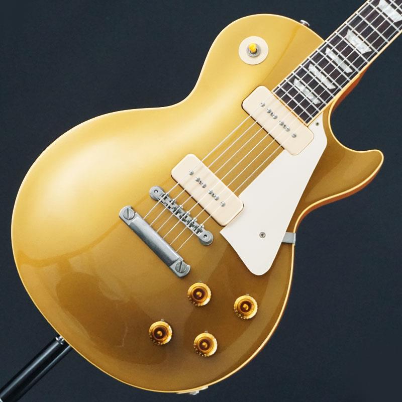 ■商品紹介ヒストリック・コレクション黎明期に製作された1997年製「1956 Les Paul Gold Top」がお預かり代行販売中古にて入荷いたしました。メイプルトップ／マホガニーバックの伝統的なウッドマテリアルに、ディープジョイント・セットネック構造を採用。1956年仕様の大きな特徴でもあるP-90ソープバー・ピックアップを2基搭載し、太く荒々しさを含みながらも豊かな倍音感を備えたヴィンテージライクなサウンドをアウトプットします。クリーントーンでは艶やかで立体感のある響きを、ドライブ時には力強く存在感のあるミッドレンジをお楽しみいただける一本です。当個体状態といたしましては、ボディ全体に経年相応の塗装やせ、軽微な割れ、スレキズ、弾きキズ、色やけ、うち傷著しいハードウェアのくすみさびが御座いますプレイヤーズコンディションとなっております。フレットは7割程度の高さを残し、ネックコンディションやトラスロッド、電装系含め演奏面で問題はございませんので、まだまだ末永くお付き合いいただける1本としてお迎えいただけます。この機会に是非ご検討ください！チェックシートケースキーオリジナルハードケース付属Weight≒4.37kg■仕様詳細Body:Maple Top Mahogany BackNeck:MahoganyFingerboard:RosewoodConstruction:Deep Joint Set-NeckFret:22Nut:BoneNut width:42.9mmScale:628mmControl: 2Volume/ 2Tone/3waySW Pickups:P90 (Soapbar)Bridge:Tune-O-Matic(ABR-1) ＆ Stop Bar Tailpiece検索キーワード：イケベカテゴリ_エレキギター_レスポールタイプ_Gibson_Custom Shop_ユーズド SW_Gibson_ユーズド 登録日:2026/07/10 エレキギター ギブソン カスタムショップ