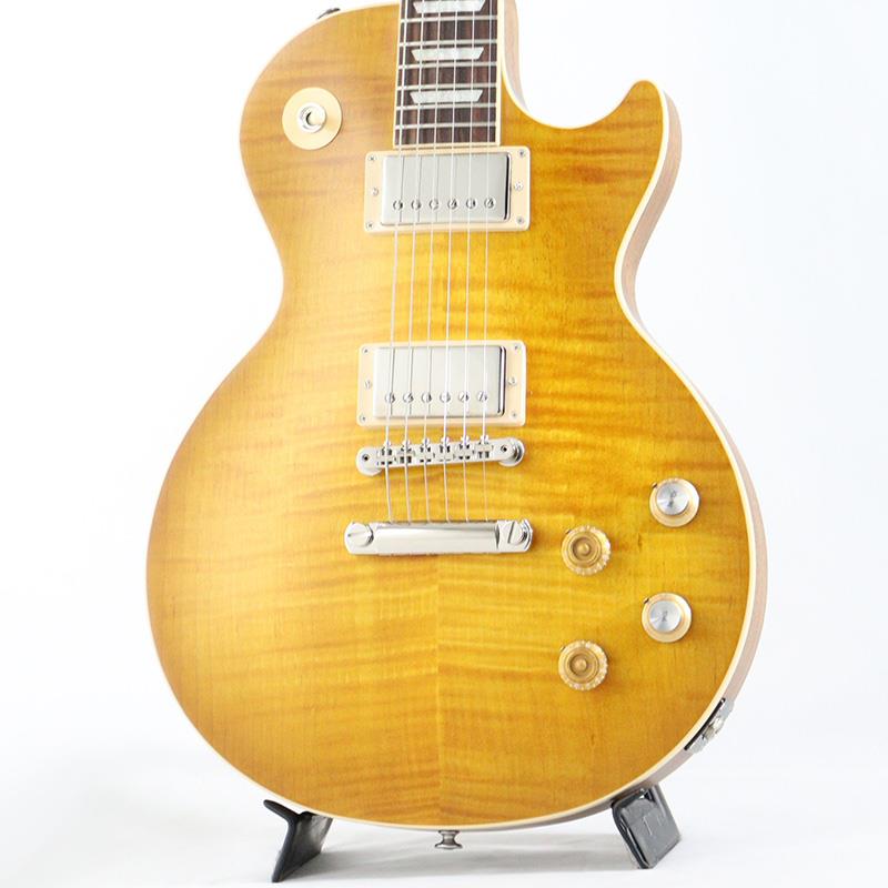 ■商品紹介Gibson USA Kirk Hammett Greeny が入荷致しました！！かつて3人の伝説のギタリストの手に渡った、伝説の1本がUSAメイドにて登場！「Greeny」のストーリーは謎に包まれていますが、これほどに輝かしいギターはありません。「Greeny」は、これまでに作られたオリジナル Les Paul(TM) Standardの中でも最も象徴的な1本であり、ギターそのものと同じようにユニークなサウンドを備えています。以前はピーター・グリーンが所有しており、フリートウッド・マック在籍中に使用され、その後ゲイリー・ムーアに売却され、シン・リジーのメンバーやソロ・アーティストとして30年に渡って使用されました。現在はメタリカのカーク・ハメットが所有しており、Greenyは3人の伝説的なギタリストのプレイを支えてきました。雰囲気抜群のAAAメイプルトップ、形状を再現したグローバーペグや、艶消しフェイデッドフィニッシュ、50sスタイルと60sスタイルが混合したコントロールノブ、専用のGreenybuckerピックアップを搭載しており、リアポジションはブリッジミュートでのザクザクしたサウンドを出力するのはもちろんのこと、ネック・ピックアップは上下逆にマウントされ、磁極が反転しているため、中間スイッチのポジションがアウト・オブ・フェイズになっており、非常に特徴的なサウンドを出力します。クールなスペックが散りばめられた逸品です。■仕様詳細Weight≒4.25kgBodyMaterial : MahoganyTop : AAA Figured MapleBinding : Single Ply Cream， Top and FretboardBody Finish : Satin Nitrocellulose LacquerNeckProfile : 50s VintageScale Length : 628.65 mm / 24.75 inFingerboard Material : Indian RosewoodFingerboard Radius : 304.8 mm / 12 inFret Count : 22Frets : Medium JumboNut Material : Graph TechNut Width : 43.053 mm / 1.695 inEnd Of Board Width : 57.404 mm / 2.26 inInlays : Acrylic TrapezoidJoint : Glued In， Set NeckHardwareFinish : NickelBridge : ABR-1 Tune-O-MaticTailpiece : Aluminum Stop BarTuning Machines : Grover Rotomatics with Contemporary ButtonsPickguard : Cream (Not Installed)Truss Rod : AdjustableTruss Rod Cover : 2-ply Bell; Black and WhiteControl Knobs : Amber Top Hats and Gold Top Hats with Gold Reflector & PointersSwitch Tip : CreamSwitch washer : CreamJack Plate Cover : BlackElectronics　　　　　　　　Neck Pickup : Greenybucker with Reversed Magnetic Polarity; Reverse MountedBridge Pickup : GreenybuckerControls : 2 Volume， 2 Tone， Hand-wired with Orange Drop CapacitorsPickup Selector : 3-way ToggleOutput Jack : 1/4ハードケース付属検索キーワード：イケベカテゴリ_エレキギター_レスポールタイプ_Gibson_Les Paul Models_新品 SW_Gibson_新品 JAN:4580568432261 登録日:2025/12/09 エレキギター ギブソン レスポール