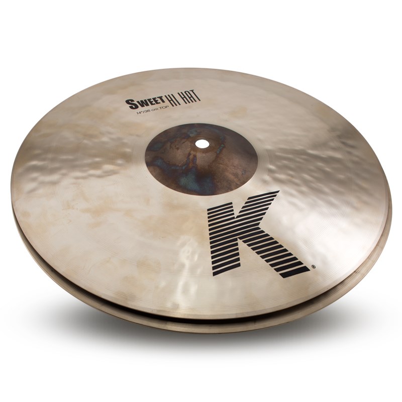 ■商品紹介【Dark Warm＋Expressive 〜豊かな響きと表現力〜】K Zildjian19世紀のトルコでの誕生以来、世界中のドラマーの創造性をかきたて続けるシリーズ。入念なハンマリングとレイジング加工が幅広い音域でのハイとローの響きをブレンドする。優しくも、激しくも、その響きはアーティストの意のままに。＜K Sweet Collection＞Kジルジャン スウィートコレクションは、Kファミリーのダークな音色をベースに、ポピュラーミュージックのワールドトレンドである、より大きく、より薄いという特長を持ち、華やかさとレスポンスを加えた、Kファミリーの奥行きを更に広げるモデルです。Kジルジャン伝統のランダムハンマリングを施し、美しくふくよかなサウンドを実現しています。＜Sweet HiHats＞レイジング（音溝加工）のないカップが、ダークかつ切れ味のよいチックサウンドを実現。サイズ：14 pairウェイト：Thin (Top) / Extra Heavy (Bottom)検索キーワード：イケベカテゴリ_ドラム_シンバル_ハイハット_Zildjian_K Zildjian_新品 SW_Zildjian_新品 JAN:0642388321959 登録日:2019/03/17 シンバル ジルジャン Kジルジャン
