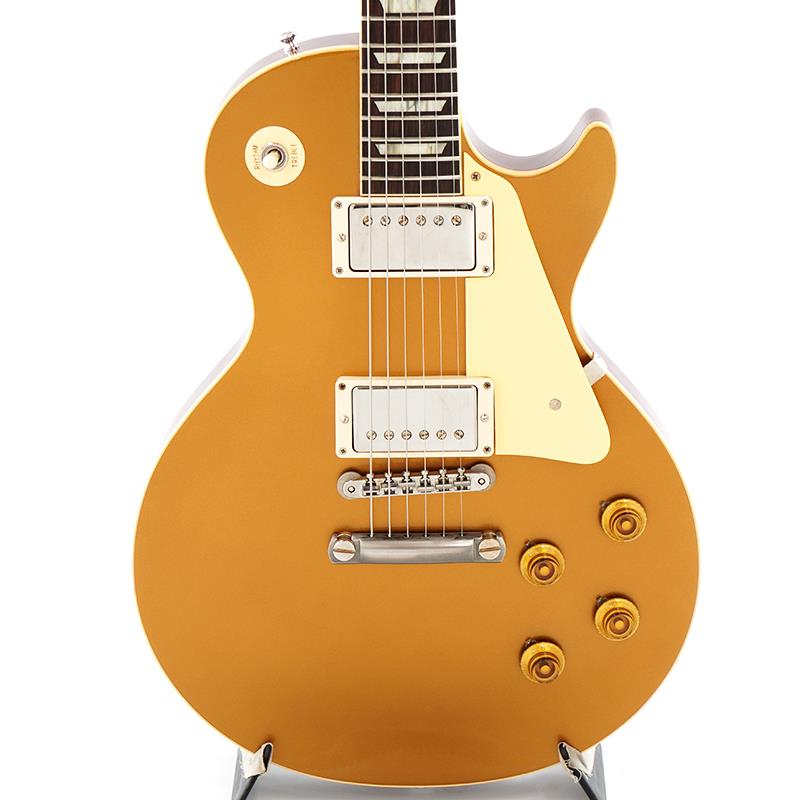 ■商品紹介【預かり代行販売中古品（委託中古品）】Double GoldカラーのGibson Custom Shop 1957 Les Paul Standard VOSの2023年製中古品です。ネック折れの為、ヘッド裏に当て木をしたネック折れリペア痕有り。ヘッドトップのシルクスクリーンの変更（オリジナルではございません。）ヘッドバックの下側に強度を保つ為の突板取り付けを行っております。（ロゴとシリアルはオリジナルになります。）通に人気の永遠カラー！神々しい魅力を放つ、Double Goldカラーが映えるGibson Custom Shop 1957 Les Paul Standard VOSの中古品です。【預かり代行販売中古品（委託中古品）】前述のようにネック折れの為、ヘッド裏に当て木をしたネック折れリペア痕がございます。他にもヘッドトップのシルクスクリーンの変更（オリジナルではございません。）ヘッドバックの下側に強度を保つ為の突板取り付けも行っております。ロゴとシリアルはオリジナルになります。修理痕の塗装は綺麗にはなされております。突板を取り付けた関係上、1弦のポストは1巻しか出来ない状態にはなっております。チューニングやプレイアビリティには支障は無い状態ではございます。こちらの商品は、預かり代行販売中古品（委託中古品）に付き、現状コンディションでのお渡しとさせて頂きます。（中古保証はございません。ご了承の程、お願い申し上げます。）長きに亘り培われた高い製作技術と飽くなき探究心、厳選されたマテリアルにより至高のエレキギター・ベースを製作するために1984年に立ち上げられたGibson Custom Shop。現在もなお昔ながらのハンドクラフト製法と、徹底的に追求したヴィンテージの知識から製作されたカスタムショップ・ラインナップは、他所の追従を許さないほどの見事な作りとなり、プレイヤーの内に秘めるインスピレーションを際限なく沸き立たせてくれる最高の愛機となるでしょう。1952年、Les Paul Model誕生以来、58年中期までラインナップされたGold Topカラー。スタンダードシリーズにおいて、58年以降になるとチェリーサンバーストを筆頭に様々なバーストが誕生致しましたが、俄然人気を誇るカラーで御座います。黄色味なインレイやエイジドされたニッケルパーツ、バンブルビー搭載などヴィンテージへの拘りが体現された至高の一本です。実はレスポールフリークの心を惹き付けて止まないゴールド・トップ！ゴールド.トップ！その甘美の黄金の魅力に取り付かれたマニアも多いのではないでしょうか！？「トラ目のサンバーストはちょっと・・」そう言う漢（おとこ）義溢れるマニア心を擽る永遠のルックスです！幾度と無くレシピがマイナーチェンジされているGibsonのGoldカラーですが、今回はまさにGold Top好きにはたまらないDouble Goldカラー！黄色味と緑色味がバランスよく交わり、落ち着いた雰囲気を醸し出すこの色を待ち侘びていた方も多いのではないでしょうか！ネックシェイプは1957 Les Paul王道のファットなネックシェイプではなく、Authentic ’59 Medium C-Shapeがセレクトされておりますので、より握り込みもし易く、プレイアビリティも良い仕様となっております！ピックアップにはCustom Shop定番となる「Custombucker Alnico III」を搭載。重たすぎずやや枯れたヴィンテージトーンが特徴的です。新たにバンブルビータイプのペーパーオイルコンデンサーとヴィンテージカーブを追及した500KのCTSポットを装備したことで、Volume・Tone共に絞りはじめの変化量が緩やかになっていますので、手元のコントロールだけで繊細かつ自在にニュアンスを変化させることができます。前述のように、近年のゴールドカラーでのメインカラーとなる Double Goldカラーの深い色合いが堪りません！VOSフィニッシュが風格を生み出しております。Faded Cherry Back仕様が渋い1本です！ウェイトは約4.21kgと、実にレスポールらしい、芯の詰まったサウンドとトーンがご堪能頂けるバランスです！今回、預かり代行販売中古品（委託中古品）が入荷致しました。2023年製になります。前述のようにヘッド折れの為、修理痕や変更箇所がございます個体になります。綺麗には直されておりますので、現状のご使用やプレイアビリティには支障、問題はございません。こちらの商品は、預かり代行販売中古品（委託中古品）に付き、現状コンディションでのお渡しとさせて頂きます。（中古保証はございません。ご了承の程、お願い申し上げます。）他には細かいスリ傷やパーツのくすみ等は見受けられますが、こちらもプレイアビリティに支障、問題はございません。※VOSシリーズはその仕上げ方の特性により、塗装/パーツ類にスクラッチや錆が元々から発生しておりますので予めご了承下さい。フレットもご使用に問題ございません。ほぼ残っております。ナットも現状のご使用に問題ございません。トラスロッドも通常の調整に問題ございません。電装系も現状の動作に問題ございません。付属品はオリジナルハードケース、鍵、認定証、Pre Pack Checklist，ブラック・トグルSWプレート、シリアル入りタグになります。この機会を是非、お見逃しなく！SN. 731682Weight≒4.21kg付属品　オリジナルハードケース、鍵、認定証、Pre Pack Checklist，ブラック・トグルSWプレート、シリアル入りタグ。※こちらの商品は、預かり代行販売中古品（委託中古品）に付き、現状コンディションでのお渡しとさせて頂きます。（中古保証はございません。ご了承の程、お願い申し上げます。）※VOSシリーズはその仕上げ方の特性により、塗装/パーツ類にスクラッチや錆が元々から発生しておりますので予めご了承下さい。■仕様詳細BodyTop Material : 2-Piece Plain Maple， Hide Glue FitBinding Style : 1-Ply RoyaliteWeight Relief : NoneFinish : Nitrocellulose VOS (Vintage Patina)NeckNeck Material : Solid MahoganyNeck Profile : Authentic ’59 Medium C-ShapeScale Length : 24.75 / 62.865cmFingerboard Material : Indian Rosewood， Hide Glue FitFingerboard Radius : 12 / 304.8mmNumber of Frets : 22Frets : Historic Medium JumboNut Material : NylonNut Width : 1.687 / 42.85mmEnd-of-Board Width : 2.24 / 56.89mmInlays : Aged Cellulose Nitrate TrapezoidHardwareFinish : NickelBridge : No-Wire ABR-1Tailpiece : Lightweight Aluminum Stop BarTuners : Kluson Single Line， Single RingPick Guard : Laminated Cellulose Acetate ButyrateTruss Rod Cover : Authentic Stepped 2-PlyControl Knobs : Butyrate Gold Top HatsSwitch Tip : Amber CatalinSwitch Washer : Silkscreened Cellulose Acetate ButyrateJack Plate : Laminated Cellulose Acetate ButyrateElectronicsNeck Pickup : Custombucker Alnico III (Unpotted)Bridge Pickup : Custombucker Alnico III (Unpotted)Controls : CTS 500K Audio Taper Potentiometers， Paper-in-Oil Capacitors※当店の取り扱い商品は中古の1点限りのご用意となります為、誠に勝手ながらご注文のお客様優先でのご案内とさせて頂きます。お問い合わせやお取置きのご依頼の際は予めご了承下さいますようお願い致します。イケベ楽器店Website以外の商品ページをご覧のお客様は、「取扱店舗の商品ページを見る」または「楽器店の購入ページへ」よりご注文下さい。入ページへ」よりご注文下さい。※当店の取り扱い商品は中古の1点限りのご用意となります為、誠に勝手ながらご注文のお客様優先でのご案内とさせて頂きます。お問い合わせやお取置きのご依頼の際は予めご了承下さいますようお願い致します。イケベ楽器店Website以外の商品ページをご覧のお客様は、「取扱店舗の商品ページを見る」または「楽器店の購入ページへ」よりご注文下さい。入ページへ」よりご注文下さい。検索キーワード：イケベカテゴリ_エレキギター_レスポールタイプ_Gibson_Custom Shop_ユーズド SW_Gibson_ユーズド 登録日:2026/01/08 エレキギター ギブソン カスタムショップ