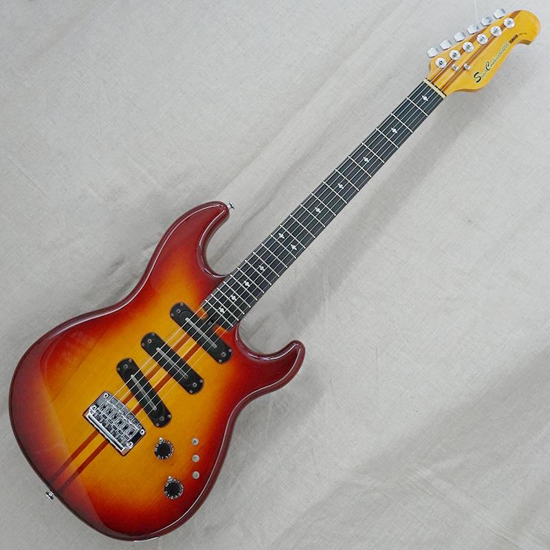 楽器種別：ヴィンテージYAMAHA/Other Models 商品一覧＞＞YAMAHA/ユーズド 商品一覧＞＞エレキギター【65，000円〜135，000円】 商品一覧＞＞その他/YAMAHA 商品一覧＞＞当店のギターは、出荷前に専門スタッフが検品・調整しているので安心です！YAMAHA VINTAGE SC-1200 '78 Stain商品説明厳選委託（お預かり代行販売）品1960年代の国産ギター黎明期より、独自色の強いオリジナルモデルを多数開発してきたヤマハ。特に1970年代からはSGやBBなどのヒットモデルを輩出し、ジャパンヴィンテージファンを中心に国内外問わず高い評価を得ています。今回入荷はシリアルナンバーから1978年頃の製造とみられる「SC-1200」、1977年頃にスタートした当時のニューモデル最上位機種となります。【ボディ】全体重量約3.55kg。STタイプを意識したようなシェイプのボディ材（ウィング材）はアルダーを採用、ヤマハおなじみのステインカラーにてフィニッシュ。全体的な傷や打痕、金属パーツのくすみなどのダメージは散見されますが、塗装はしっかりと艶が残っており年式を考慮すれば十分にキレイなコンディションと言えるでしょう。【ネック】ネックマテリアルはメイプル/マホガニーの5ピース、ローズウッド指板。スルーネック仕様となります。ネック裏6フレット相当のあたりに大きめの打痕がございます。チューナーは巻き具合に若干のバラつきがあるもののしっかりと機能しております。ナットは過去に交換済、フレットは少々の減り程度で演奏性は良好です。ナット幅約41.9mm。ヤマハらしいスマートなネックシェイプが特徴です。【電装系】コントロールは【1ヴォリューム／1トーン】と非常にシンプルですが、3つの「スリーポジション・フェイズスイッチ」が肝となります。各ピックアップの位相とOFFを切り替え可能で、全13パターンの組み合わせを実現。バイサウンドこそ搭載されていませんが、非常に多彩なサウンドバリエーションが楽しめます。トーンポットが交換されています。付属品：YAMAHAソフトケース商品詳細Weight：3.55kgBody Material：AlderNeck Material：Maple/Mahogany， 5 pieceFingerboard：RosewoodNut Width：41.9mmFret Width：2.0mmNeck Thickness（1F／7F／12F）：21.8mm／22.6mm／23.5mmPickups（Neck／Bridge）：YAMAHA C-I（4.7kΩ／4.8kΩ／4.7kΩ）※ピックアップの直流抵抗値はコントロール部を通した計測となります-------Heartman Vintage Guitarsは池部楽器店のヴィンテージ・ギター＆ベースの専門店です-------イケベカテゴリ_エレキギター_その他_YAMAHA_Other Models_ユーズド SW_YAMAHA_ユーズド JAN:2500010904568 登録日:2026/07/17 エレキギター ヤマハ やまは