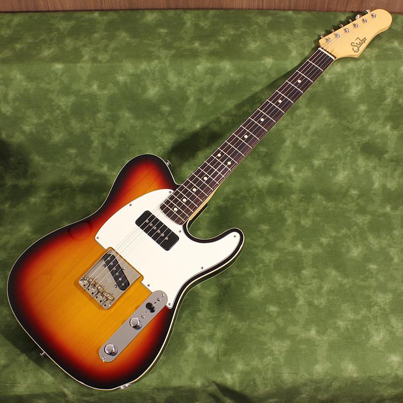 楽器種別：ユーズドSuhr Guitars/CUSTOM SERIES 商品一覧＞＞Suhr Guitars/ユーズド 商品一覧＞＞エレキギター【325，000円〜610，000円】 商品一覧＞＞TLタイプ/Suhr Guitars 商品一覧＞＞当店のギターは、出荷前に専門スタッフが検品・調整しているので安心です！Suhr Guitars USED 中古 Classic T 3-Tone Burst Landau Headstock SN. 15872商品説明先日当店より中古販売したレアモデルが電撃カムバック！前回の販売時とほぼ全く変わらないと言って良い程の良質コンディション！シンプルでありながらも意外なほどのレアで配慮の行き届いたプレイヤーが使い易いClassic Tの逸品です。コンディションの良いお買い得中古でぜひゲットして下さい！--------------------以下、前回掲載時の説明文となります--------------------P90タイプピックアップ搭載の2013年製Classic Tの中古品です。我らがMichael Landau氏もかつて本機と近しい仕様の個体を使用しており、玄人好みのポイントを押さえた実戦仕様が高い完成度を誇る魅惑の1本です。数多くの現場を渡り歩く職人ギタリストが今一番欲しいギター、Suhr Guitar。どのポジションも弾き易いプレイアビリティの良さとノイズの少なさ、サウンドバリエーションの広さ、最新機材との相性の良さ、プレイヤーのインスピレーションをダイレクトに伝えるレスポンスの良さ等、トップギタリストが求める全てを兼ね備えたプロフェッショナルギターがSuhr Guitarなのです！3-Tone Burstのアルダーボディにメイプルネック/ローズウッド指板のトラディショナルな60sスタイルのClassic T。現在はオーダー不可の「Landau Headstock」もインパクト大の1本です。7.25インチラディアスにSuhrとしては小さめのMediumサイズフレットのヴィンテージテイストの弾き味はオールドギターとの持ち替えもスムーズです。ブリッジサドルにはオクターブピッチの微調整が可能な3 Saddle Vintage Tを搭載。ブラス製サドルならではのヴィンテージルックと太くも明るい鳴りがTLファンの胸を打ちます！ピックアップは実はTLシェイプと相性の良いJST流P90タイプモデル「S90」をネックポジションに装備した本機。ファットでありながらもクリアに抜ける「使える」ネックPUサウンドはTLタイプの新境地を切り拓きます。ミックスポジションでもTLタイプらしいジャキジャキと金属的な響きは感じさせつつも奥行きを感じさせる立体的なふくよかさも持ち合わせています。シングルコイルのノイズを軽減させるSSCIIは本機ではアクティブ回路を採用し、雑味の少ないピュアなサウンドをアウトプット。アクティブ回路を駆動させる9Vバッテリーはコントロールパネル下に収納されています。年式の割には使用感は控えめで綺麗なコンディションの中古品です。軽微なピッキングスクラッチや金属パーツのくすみは見られますが目立つ打ちキズや使用によるフレットの減りは見られず外観、演奏面共に良い状態が保たれております。ネックPUのS90は高さを稼ぐ為にPU下に仕込まれたゴム素材が経年で収縮してしまい、ややネック側が落ちて傾いています。その他TLタイプで起こりがちなPUセレクターキャップが抜けやすくなっている点の改善のためセレクターSWシャフトにマスキングテープを薄く巻いてあります。正規輸入品Serial No. 15872Weight≒3.48kgハードケース、スペックシート、レンチ付商品詳細Body: Alder 2-PieceNeck: Quartersawn MapleFingerboard: Indian RosewoodNeck Shape: 60's C Vintage Medium .830-.950inchFingerboard Radius: 7.25inchNut: White Tusq， 1.650inchFrets: 21， MediumSide Dots: ClayFingerboard Inlay: Face Dots， ClayTuning Gear: Gotoh KlusonBridge: 3 Saddle Vintage TNeck Pickup: JST S90 NeckBridge Pickup: JST Classic T BridgeControl: Volume， Tone， 3-wayElectronics: Active SSCII String Gauge: .010-.046イケベカテゴリ_エレキギター_TLタイプ_Suhr Guitars_CUSTOM SERIES_ユーズド SW_Suhr Guitars_ユーズド JAN:2500010881616 登録日:2026/05/11 エレキギター サー Shur