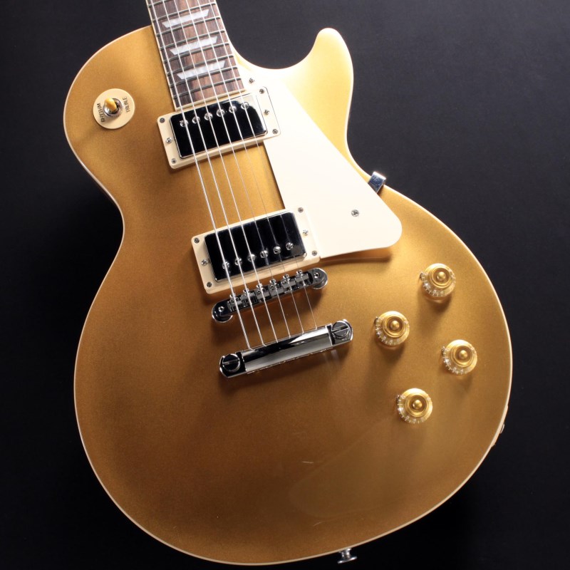 楽器種別：新品エレキギター/Gibson 商品一覧＞＞エレキギター/Gibson/Les Paul Models 商品一覧＞＞エレキギター【225，000円〜420，000円】 商品一覧＞＞当店のギターは、出荷前に専門スタッフが検品・調整しているので安心です！Gibson Les Paul Standard '50s (Gold Top)商品説明Gibson Les Paul Standard '50sギブソンの定番モデル「レスポール・スタンダード」が入荷！コチラは、王道のメイプルトップ、マホガニーバックを採用したクラシックな50'sルックスモデルです。ウエイトリリーフを施さないソリッドボディを採用、ネックシェイプは程よいグリップ感のあるVintage 50sを採用しています。キャビティはトラディショナルモデルと同様に、基盤を使わず配線されており、コンデンサーはオレンジドロップが使われております。サウンドの要であるピックアップには、バーストバッカー1&バーストバッカー2を搭載。野太いクリーントーンはもちろん、歪ませても無骨でありながらもバランスの良いドライブサウンドを奏でてくれます。ギブソン王道のロックサウンドを求めるギタリストには是非ともオススメの1本です。是非この機会をお見逃しなく！※画像はサンプルです。商品詳細BodyMaterial:MahoganyTop:MapleWeight Relief:NoneNeckNeck:MahoganyProfile:Vintage 50sNut width:1.695 / 43.05mmFingerboard:RosewoodScale length:24.75 / 628.65mmNumber of frets:22Nut:Graph TechInlay:Acrylic TrapezoidsHardwareBridge:ABR-1 Tune-O-MaticTailpiece:Aluminum Stop BarKnobs:Amber Top Hats w/ PointersPlating:NickelElectronicsNeck Pickup:Burstbucker 1Bridge Pickup:Burstbucker 2Controls:2 Volumes， 2 Tones & Toggle Switch (Hand-wired with Orange Drop Capacitors)ハードケース付属イケベカテゴリ_ギター_エレキギター_Gibson_Les Paul Models_新品 JAN:4580228786925 登録日:2023/07/26 エレキギター ギブソン レスポール