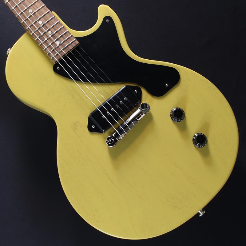 楽器種別：新品Gibson/Les Paul Models 商品一覧＞＞Gibson/新品 商品一覧＞＞エレキギター【125，000円〜245，000円】 商品一覧＞＞レスポールタイプ/Gibson 商品一覧＞＞当店のギターは、出荷前に専門スタッフが検品・調整しているので安心です！Gibson Les Paul Junior (TV Yellow) #214760019商品説明不朽のシンプリシティと無二のサウンドレスポール・ジュニアーが新たに、往年のクラシックなデザインを纏ってのリリースとなります。そのクラシックなデザインは、ミュージックシーンとの結び付きが強く、今までに数多のギタリストを虜にし、世代や音楽ジャンルの垣根を越え音楽の創造に貢献してきたデザインです。ギブソン社は技術革新における往年のギブソンの黄金期に敬意を表し、その正真正銘なるデザインを現代に蘇らせます。1954年のリリース時こそ、学生やビギナー向けのお求め安いモデルの位置づけでしたが、レスポール・ジュニアーはその後60年間にもわたり多くの本格的なミュージシャン達を虜にし続けています。平板でシングル・カッタウェーが施されたマホガニー・ボディ、ドッグイヤー・タイプのP90ピックアップ、1ヴォリューム、1トーンといったシンプルな仕様により、単に同様のパーツを寄せ集めたものを遥かに凌ぐ最高のギターに仕上がっています。50年代スタイルの肉厚なネック・プロファイルとラップアラウンド・ブリッジはロックのソリッドな響きに最適解をもたらします。商品詳細BodyBody Material: MahoganyFinish: Gloss Nitrocellulose LacquerNeckNeck Material: MahoganyNeck Profile: Vintage 50sScale Length: 24.75 / 62.865cmFingerboard Material: RosewoodFingerboard Radius: 12 / 304.8mmNumber of Frets: 22Frets: Medium JumboNut Material: Graph TechNut Width: 1.695 / 43.05mmEnd-of-Board Width: 2.26 / 57.4mmInlays: Acrylic DotsHardwareFinish: NickelBridge: WraparoundTuners: Vintage Deluxe w/ White ButtonsPick Guard: VT: Black / EB: Tortoise shellControl Knobs: Black Top HatsJack Plate: BlackElectronicsBridge Pickup: P-90 Dog EarControls: 1 Volume， 1 Tone (Hand-wired with Orange Drop Capacitors)MiscellaneousStrings: .010， .013， .017， .026， .036， .046約3.30kgハードケース付属イケベカテゴリ_エレキギター_レスポールタイプ_Gibson_Les Paul Models_新品 SW_Gibson_新品 JAN:4570156008886 登録日:2026/08/11 エレキギター ギブソン レスポール