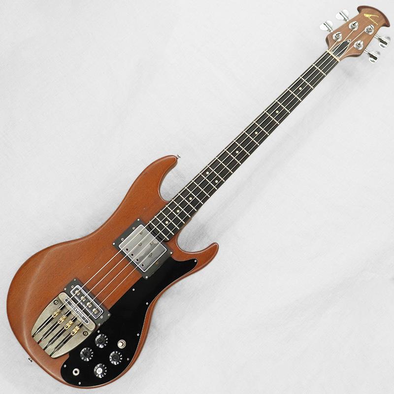 楽器種別：ヴィンテージOVATION/ユーズド 商品一覧＞＞ベース【160，000円〜300，000円】 商品一覧＞＞エレキベース/その他ベース一般/OVATION 商品一覧＞＞当店のベースは、出荷前に専門スタッフが検品・調整しているので安心です！OVATION 1264 Magnum Bass Converted to Version 3 late70's Natural商品説明ボウル型のボディバックを持つエレアコでおなじみの「Ovation（オベーション）」ですが、1970年代には『Breadwinner（ブレードウィナー）』、『Deacon（ディーコン）』、『Viper（ヴァイパー）』、『Preacher（プリーチャー）』、『Magnum Bass（マグナムベース）』等、個性的なソリッドボディモデルを生産していたことでもおなじみです。『Magnum Bass（マグナムベース）』シリーズはバージョン1から4までラインナップされております。バージョン1はシングルカッタウェイボディのパッシヴ仕様、バージョン2は1のグラフィックイコライザー付き、バージョン3はダブルカッタウェイボディシェイプのパッシヴ仕様、バージョン4は3のグラフィックイコライザー付きとなっております。今回入荷のマグナムベースですが、バージョン4のグラフィックイコライザーを外し、パッシヴ仕様にモディファイされた1本となります。【ボディ】全体重量は約4.4kg。ボディ材は良質なマホガニー。ダブルカッタウェイボディにデタッチャブルネックの基本仕様マホガニーの色を生かした渋いカラーリングがいいですね。グラフィックイコライザーを外し、ピックガードを新調しております。細かな打痕、バック面のストラップピン移動跡、コントロールノブのプレート外れ、金属パーツのくすみはみられますが、比較的きれいなコンディションといえるでしょう。フロントピックアップリングの止めねじが交換済みです。【ネック】ネック材はマホガニー。フィンガーボード材はエボニー。ネック裏の塗装浮き等はみられますが、比較的きれいなコンディションといえるでしょう。チューナーは巻き具合にそれほどバラつきはなくしっかりと機能します。フレット／ナットは少々の減り程度でプレイアビリティは良好です。ナット幅41.8mm。がっしりとしたネックシェイプが特徴です。【電装系】現在はパッシヴ仕様にコンバート済みで、コントロールは【3wayピックアップセレクター／2ボリューム／2トーン】となります。フロントピックアップは半固定抵抗器により各弦の出力を個別に調整できるタイプ、リアピックアップは1〜2弦と3〜4弦のコイルが分割されてハムキャンセルされるタイプとなっております。前述のとおりグラフィックイコライザーを外し、パッシヴ仕様にモディファイされており、POT、キャパシター、スイッチ、アウトプットジャックが新調されて、使いやすく仕上げられております。付属品：Ovationブラウンハードケース商品詳細Weight：4.4kgBody Material：MahoganyNeck Material／Scale Length：Mahogany 2 piece／863mm（34inch）Fingerboard／Fret Marker／Radius：Ebony／Pearloid dot／241.3mm（9.5inch）Nut Width／Fret Size：41.8mm／2.6mm， 20 FretNeck Thickness（1F／7F／12F）：22.0mm／24.7mm／26.1mmPickup（Neck／Bridge）：Ovation Four Coil Humbucking Bass Pickup／Ovation Two Coil Humbucking Bass Pickup（11.1kΩ／4.0kΩ）※ピックアップの直流抵抗値はコントロール部を通した計測となります-------Heartman Vintage Guitarsは池部楽器店のヴィンテージ・ギター＆ベースの専門店です-------イケベカテゴリ_ベース_エレキベース_その他ベース一般_OVATION_ユーズド SW_OVATION_ユーズド JAN:2500030528904 登録日:2026/02/25 エレキベース オベーション