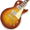 楽器種別：新品エレキギター/Gibson 商品一覧＞＞エレキギター/Gibson/Custom Shop 商品一覧＞＞エレキギター【570，000円〜1，065，000円】 商品一覧＞＞当店のギターは、出荷前に専門スタッフが検品・調整しているので安心です！Gibson 1959 Les Paul Standard Reissue VOS (Iced Tea Burst)【Weight≒3.86kg】商品説明King Of Les Paul！！ 1959 Les Paul Standard Reissue VOS Iced Tea Burstが入荷！長きに亘り培われた高い製作技術と飽くなき探究心、厳選されたマテリアルにより至高のエレキギター・ベースを製作するために1993年に立ち上げられたGibson Custom Shop。現在もなお昔ながらのハンドクラフト製法と、徹底的に追求したヴィンテージの知識から製作されたカスタムショップ・ラインナップは、他所の追従を許さないほどの見事な作りとなり、プレイヤーの内に秘めるインスピレーションを際限なく沸き立たせてくれる最高の愛機となるでしょう。究極のリイシューモデルとして2015年に登場したTrue Historicスペックを大部分で踏襲した2018年仕様をベーシックに、細部に亘りさらなる拘りを持ってリファインされた最先端のカスタムショップ製Les Paul Standard。まさに「顔」とも呼ぶべきヘッドの「Les Paul MODEL」シルクスクリーンの色合いの見直しの他、Gibsonロゴデザインもよりオリジナルに近い、エッジ感のあるデザインに変更。インレイは指板ポジションマークも含め、着色によるものではなく元々色合いの濃いセルロース素材を使用することで一層雰囲気を高めています。市場での人気が高いものの流通数の少ないIced Tea Burstカラーとの組み合わせが改めて59レスポールの美しさを物語っている本機。3.86kgいうレスポールとしてはやや軽めのウェイトで取り回しも良く、芳醇な生鳴りがアンプにプラグインする前から貴方を楽しませてくれるでしょう！1959 Les Paulならではの光の当たり方や角度で変化するボディの杢目と色合いはギブソンのゴールデンエラに作られたオールド独特のルックスとプレイフィールを再現しています。昨今の1959モデルというとMurphy Labによるエイジング加工が定番となっておりますが当モデルはVOS塗装となっておりウェザーチェックなどが入っていない艶を抑えたグロス仕上げとなっております。金属パーツはサビやくすみを再現しているためウェザーチェックやエイジング加工がお好みでない方には見逃せないオススメの一本となります。ネックシェイプは「Authentic '59 Medium C-Shape」を採用しており太すぎず細すぎず、現代的なプレイスタイルにも対応できる仕上がりとなっております。ピックアップは近年の定番モデルとなっているCustombucker Alnico IIIを継続して採用。キレのよいバイト感と個体がもたらす豊かなトーンバランスは本機でしか味わえない絶品サウンドをご体感頂けることでしょう。新たに搭載されたバンブルビータイプのペーパーオイルコンデンサーやヴィンテージカーブを追及した500KのCTSポットを装備。通常仕様の500kΩポットに比べてボリュームを絞っても極端に高域が削られず、手元の操作でクリーンサウンドからドライブサウンドまでを自在に操ることができます。10〜6のメモリまでは歪みが維持され、6〜1にかけて滑らかにダウンしていくので、ボリュームコントロールの長さによって表情豊かなプレイを可能にしています。3.86kgというウェイトから放たれる音は生音から良く鳴り、振動がボディからネックにかけてしっかりと伝わってきます。ディストーションサウンドから甘いクリーントーンまでこの1本で全てを網羅できると感じさせてくれるサウンドとなっております。細部にまでヴィンテージに拘りを持ったGibsonが送る最新スペックは、あなたのギターライフをより豊かにしてくれること間違い御座いません！！是非お手にとってご体感ください！！商品詳細■Weight≒3.86kg■S/N:9 32345【SPEC】Body:2PC Maple Top/Mahogany BackNeck:Mahogany w/Long TennonProfile: Authentic ’59 Medium C-ShapeFingerboard:RosewoodFrets:Historic Medium-JumboNut:NylonHardware:Nickel AgedBridge:No-Wire ABR-1 & Lightweight Aluminum TailpieceMachinehead:Kluson ReissuePickups:Custombucker Alnico III (Unpotted)Control:2Volume-2Tone-3way Toggle SWカスタムショップ・ブラウン・ハードケース、認定書他付属イケベカテゴリ_ギター_エレキギター_Gibson_Custom Shop_新品 JAN:4580568415196 登録日:2023/07/28 エレキギター ギブソン カスタムショップ