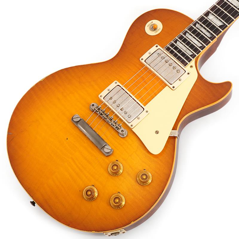楽器種別：新品Gibson/Custom Shop 商品一覧＞＞Gibson/新品 商品一覧＞＞エレキギター【775，000円〜1，445，000円】 商品一覧＞＞レスポールタイプ/Gibson 商品一覧＞＞当店のギターは、出荷前に専門スタッフが検品・調整しているので安心です！Gibson 1959 Les Paul Standard Reissue B-Top Murphy Lab Light Aged (Golden Poppy Burst) 【S/N 9 6293】商品説明2025年10月にNashville Custom Shop Factoryでハンドセレクトしたトップ材を使用した1本が入荷いたしました！！セレクト材ならではのリッチな表情と、鮮やかさを残しつつも深みのあるヴィンテージライクなGolden Poppy Burstフィニッシュによる極上のコンビネーションがご堪能いただけます。長きに亘り培われた高い製作技術と飽くなき探究心、厳選されたマテリアルにより至高のエレキギター・ベースを製作するために1993年に立ち上げられたGibson Custom Shop。現在もなお昔ながらのハンドクラフト製法と、徹底的に追求したヴィンテージの知識から製作されたカスタムショップ・ラインナップは、他所の追従を許さないほどの見事な作りとなり、プレイヤーの内に秘めるインスピレーションを際限なく沸き立たせてくれる最高の愛機となるでしょう。〜Murphy Labとは〜カスタムショップ内に誕生したMurphy Lab（マーフィー・ラボ）は、ナッシュヴィルのギブソン・カスタムショップ内に新設されたラボで、科学的検証に基づく最新の技術を駆使して、ギターのエイジング（ヴィンテージ・ギターの経時変化した外観と弾き心地を再現する処理）を専門に行います。ギブソン・カスタムショップの立ち上げ時のメンバーであり、ヒストリック・コレクション開発のプロジェクト・リーダーとして尽力したトム・マーフィーは、その後新品のギターにヴィンテージのルックスとフィーリングをもたらすエイジングというテクニックで活躍してきました。トムのヴィンテージ・ギターへの情熱と深い知識に裏打ちされた技術によって、ギブソン・ギターの自然なラッカーのクラック、演奏による摩耗を見事に再現しています。トム・マーフィーとギブソンは、経時変化によりウェザーチェックと呼ばれるクラックを生じさせる、1950年代、1960年代のニトロセルロースラッカーを科学的に解析し、その変化のプロセスをひも解き、あらゆるモデルのプロトタイプによるテストを重ねて、ヴィンテージ同様のナチュラル・ウェザーチェックを再現するラッカー・プロセスを開発しました。 マーフィー・ラボは、トム・マーフィーがギブソン・カスタムショップのチームを率いて、プロトタイプをもとに、あらゆるボディシェイプ、フィニッシュ、エイジング・レベルの検証を始めたことから、その構想が生まれました。その結果、これまでにないリアリティとこだわりを追求したエイジングを行うために、ギブソン・カスタムショップ内に設立されました。 トム・マーフィーの存在と、その芸術的な作品の数々は、ギブソンの歴史の中で重要な役割を果たし、今もそしてこれからもマーフィー・ラボとして永遠に引き継がれていきます。 本機は4段階で設けられたエイジング・レベルの中で2番目となる「Light Aged」が施された1959 Les Paul Standard Reissue。細かくも芸術的に施されたウェザーチェックに加え、適度に弾き込まれたような小傷やエッジの塗装剥がれ等が見事に再現されており、個体ごとにより表情が異なった唯一無二を体現！指板エッジにはロールド加工が施され、優れたグリップ感がプレイヤーの皆様にはさらに嬉しい仕上げとなっております。 エレキギター史に燦然と輝く1959 Les Paul Standard Model。数々のミュージシャンを虜にした圧倒的な存在感を放つサウンド、そして艶かしく弾き手を魅了する美しいボディラインは現代に於いても全てのロックギタリスト憧れのアイコンと言えるでしょう。1952年発売以来のゴールドトップ期を経て1958年にサンバーストフィニッシュを採用し、1960年までの僅かな期間にその姿で製作された「Les Paul Standard」。その中でも代表的年度として一際の人気を誇る「1959」モデルは常に羨望の眼差しを集める偉大な存在として君臨し続けております。 基本的なスペックは最新のHistoric Specを採用しつつも今回搭載されるCustombuckerにはAlnico 2マグネットを採用。傾向としてはやや低出力ながらもバイト感のあるソリッドなサウンドはドライブさせても鋭さを失わず、ダイナミクス溢れる至高のロックトーンを生み出します。軽微なエイジングが施されたピックアップカバーの下にはLes Paulファンの方には堪らないAged Double Blackのボビンを採用しております。 新たに搭載されたバンブルビータイプのペーパーオイルコンデンサーやヴィンテージカーブを追及した500KのCTSポットを装備。通常仕様の500kΩポットに比べてボリュームを絞っても極端に高域が削られず、手元の操作でクリーンサウンドからドライブサウンドまでを自在に操ることができます。10〜6のメモリまでは歪みが維持され、6〜1にかけて滑らかにダウンしていくので、ボリュームコントロールの長さによって表情豊かなプレイを可能にしています。トーンを絞った際の音抜け感の良さは勿論のこと、ボリュームを絞っても程良くブライトさがキープされるコントローラブルなアッセンブリーは現代的な使用方法とも素晴らしい相性を見せてくれるでしょう！！現地オーダー品ならではのスペックが非常に興味深い1本です。Custom Shop製ならではの素晴らしいトーン、Murphy Labが生み出す迫力満点のエイジングをぜひご堪能下さい！S/N 9 6293Weight≒3.96kg商品詳細BodyBody Top: Hand Selected 2-Piece Figured Maple Top， Hide Glue FitBody Back: 1-Piece Lightweight MahoganyBinding: 1-Ply RoyaliteWeight Relief: NoneFinish: Nitrocellulose Lacquer; Murphy Lab Ultra Light AgedNeckNeck Material: Solid MahoganyProfile: Authentic '59 Medium C-ShapeScale Length: 24.75 / 628.65mmFingerboard Material: Indian Rosewood， Hide Glue FitFingerboard Radius: 12Number Of Frets: 22Frets: Historic Medium-JumboNut Material: NylonNut Width: 1.69 / 42.85mmEnd of Board Width: 2.24 / 56.89mmInlays: Cellulose Nitrate TrapezoidJoint: Long Tenon， Hide Glue FitHardwareFinish: Nickel; Murphy Lab Light AgedTuner Plating: NickelBridge: ABR-1Saddle Material: Nickel-plated BrassTailpiece: Lightweight Aluminum Stop BarTuning Machines: Kluson Single Line， Single RingPickguard: Laminated Cellulose Acetate ButyrateControl Knobs: Gold Butyrate Top HatsElectronicsNeck Pickup: Custombucker Alnico 2 (Unpotted)Bridge Pickup: Custombucker Alnico 2 (Unpotted)Controls: 2 Volume， 2 Tone， CTS 500K Audio Taper Potentiometers， Paper-in-Oil CapacitorsPickup Selector: 3-Way Switchcraftカスタムショップ・ブラウン・ハードケース、認定書、他付属イケベカテゴリ_エレキギター_レスポールタイプ_Gibson_Custom Shop_新品 SW_Gibson_新品 JAN:4570156021670 登録日:2026/05/13 エレキギター ギブソン カスタムショップ