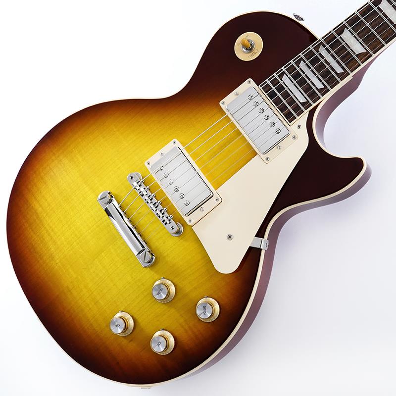 楽器種別：新品Gibson/Les Paul Models 商品一覧＞＞Gibson/新品 商品一覧＞＞エレキギター【225，000円〜420，000円】 商品一覧＞＞レスポールタイプ/Gibson 商品一覧＞＞当店のギターは、出荷前に専門スタッフが検品・調整しているので安心です！Gibson Les Paul Standard '60s (Iced Tea) SN.227550078商品説明Gibson Les Paul Standardギブソンの定番モデル「レスポール・スタンダード」が入荷！コチラは、AAフィギュア・メイプルトップやスリムテーパーのネックシェイプを採用した60's仕様採用モデルです。ウエイトリリーフを施さないソリッドボディに、握りやすいスリムテーパーのネックをジョイント。キャビティはトラディショナルモデルと同様に、基盤を使わず配線されており、コンデンサーはオレンジドロップが使われております。サウンドの要であるピックアップには、バーストバッカー61R&バーストバッカー61Tを搭載。芯のあるクリーントーンはもちろん、歪ませても骨太でバランスの良いドライブサウンドを奏でてくれます。ギブソン王道のロックサウンドを求めるギタリストには是非ともオススメの1本です。是非この機会をお見逃しなく！Weight≒4.30kgハードケース付属商品詳細BODY.....AA Figured Maple Top / Solid Mahogany BackNECK.....MahoganyPROFILE....Slim TaperFINGERBOARD.....Rosewood / 22FHARDWARE.....NickelKNOBS.....Gold Top Hats with Silver Reflector & PointersBRIDGE.....ABR-1 Tune-O-Matic & Aluminum Stop BarMACHINEHEAD.....Grover Rotomatics w/ Kidney ButtonsPICKUP.....Burstbucker 61R (R) & Burstbucker 61T (T)CONTROL.....2Volume-2Tone-3way Toggle SWイケベカテゴリ_エレキギター_レスポールタイプ_Gibson_Les Paul Models_新品 SW_Gibson_新品 JAN:4580228786963 登録日:2024/09/29 エレキギター ギブソン レスポール