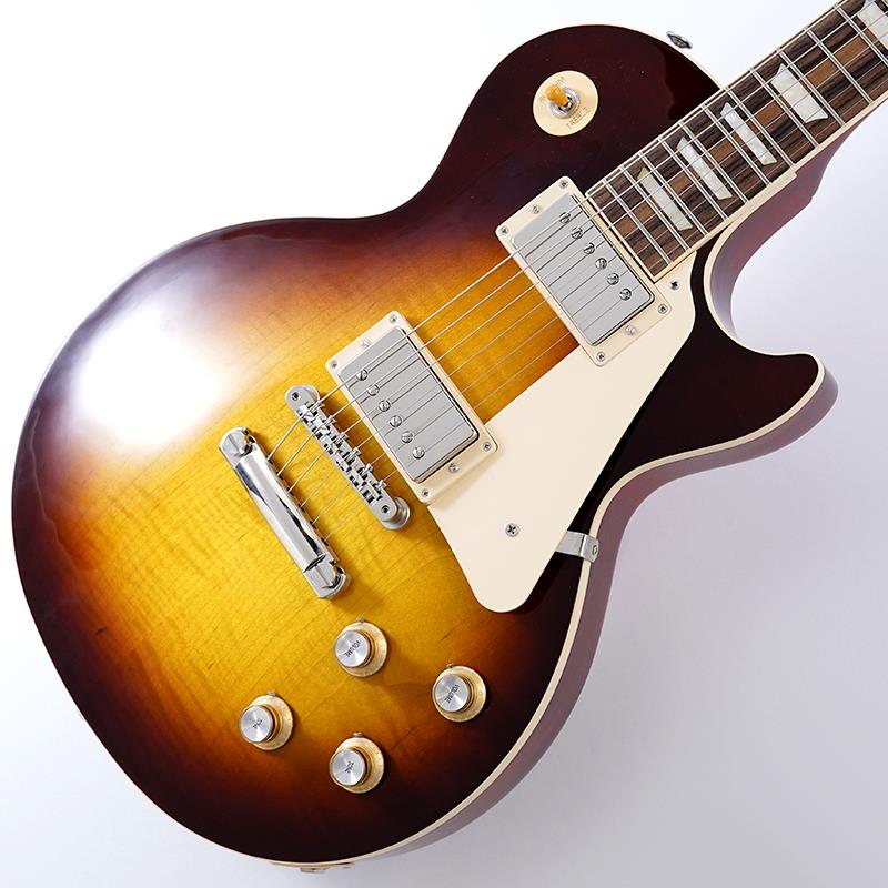 楽器種別：アウトレットGibson/Les Paul Models 商品一覧＞＞Gibson/アウトレット 商品一覧＞＞エレキギター【175，000円〜330，000円】 商品一覧＞＞レスポールタイプ/Gibson 商品一覧＞＞当店のギターは、出荷前に専門スタッフが検品・調整しているので安心です！Gibson Les Paul Standard '60s (Iced Tea) SN.224550156 【B級特価】商品説明B級アウトレットスペシャルプライス！Gibson Les Paul Standardギブソンの定番モデル「レスポール・スタンダード」が入荷！コチラは、AAフィギュア・メイプルトップやスリムテーパーのネックシェイプを採用した60's仕様採用モデルです。ウエイトリリーフを施さないソリッドボディに、握りやすいスリムテーパーのネックをジョイント。キャビティはトラディショナルモデルと同様に、基盤を使わず配線されており、コンデンサーはオレンジドロップが使われております。サウンドの要であるピックアップには、バーストバッカー61R&バーストバッカー61Tを搭載。芯のあるクリーントーンはもちろん、歪ませても骨太でバランスの良いドライブサウンドを奏でてくれます。ギブソン王道のロックサウンドを求めるギタリストには是非ともオススメの1本です。是非この機会をお見逃しなく！※本商品はB級特価品となります為、細かな擦り傷や、パーツのくすみが散見します。※掲載画像以外の外観瑕疵部分がある場合がございます。※保証に関しましてはプレイアビリティに関する点のみとなり、通常とは異なるアウトレット保証となります。Weight≒4.57kgハードケース付属商品詳細BODY.....AA Figured Maple Top / Solid Mahogany BackNECK.....MahoganyPROFILE....Slim TaperFINGERBOARD.....Rosewood / 22FHARDWARE.....NickelKNOBS.....Gold Top Hats with Silver Reflector & PointersBRIDGE.....ABR-1 Tune-O-Matic & Aluminum Stop BarMACHINEHEAD.....Grover Rotomatics w/ Kidney ButtonsPICKUP.....Burstbucker 61R (R) & Burstbucker 61T (T)CONTROL.....2Volume-2Tone-3way Toggle SWイケベカテゴリ_エレキギター_レスポールタイプ_Gibson_Les Paul Models_アウトレット SW_Gibson_アウトレット JAN:2500010118842 登録日:2026/09/10 エレキギター ギブソン レスポール