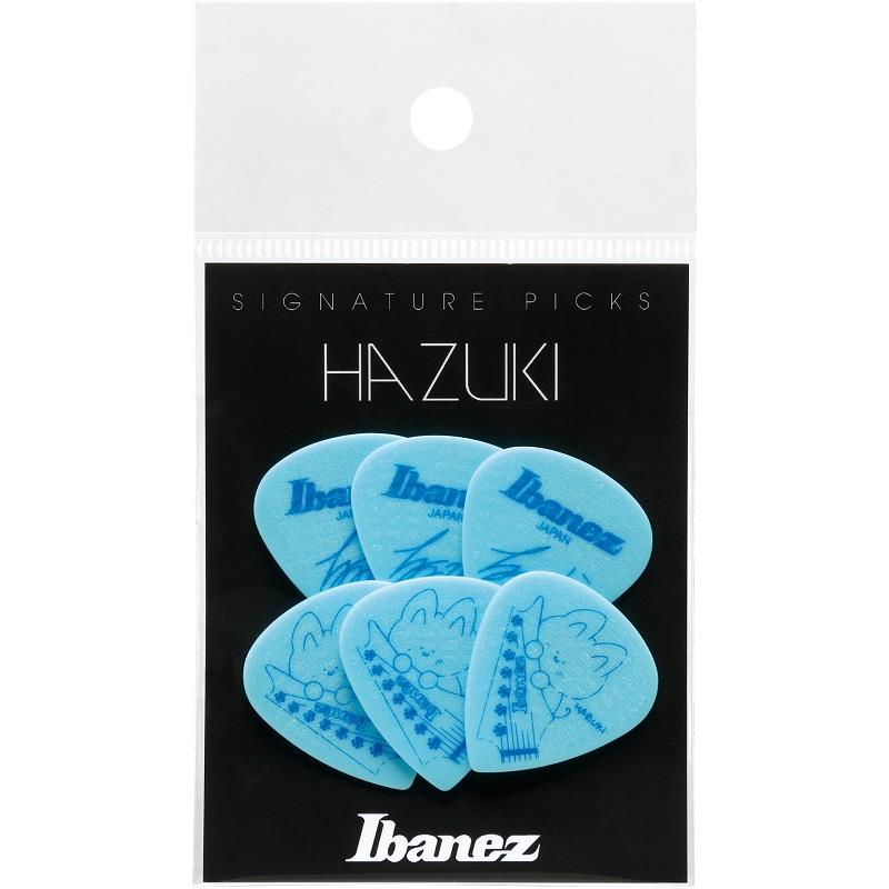楽器種別：新品Ibanez/新品 商品一覧＞＞楽器アクセサリ【〜5，000円】 商品一覧＞＞ピック/Ibanez 商品一覧＞＞品揃え豊富な当店なら弦、パーツ、ケーブルなどのアクセサリーがまとめて揃います！Ibanez HAZUKI (NEMOPHILA， KOIAI) シグネチャー・ピック6枚パック[P1000HZK-LT]商品説明※本製品は、HAZUKI シグネチャー・ピック1000HZK-LTを6枚封入したパッケージ製品です。ヘヴィなサウンドとテクニカルなフレージングを持ち味に、NEMOPHILAやKOIAIで活躍しているギタリスト、HAZUKI。可愛らしいデザインと扱いやすい仕様が多くの反響をいただいたシグネチャー・ピック1000HZKに、新たなカラーが仲間入りします。基本仕様は1000HZKを踏襲しながらも、本人からのリクエストをもとに、素材には水色(Light Teal)のポリアセタールを採用し、新たにHAZUKI本人が描き下ろしたイラストをあしらっています。演奏時の扱いやすさと見た目の可愛らしさとを兼ね備えた、魅力溢れるシグネチャー・ピックです。HAZUKI シグネチャー・ピック1000HZK LTを6枚封入したパッケージ製品です。素材には1mm厚の水色(Light Teal)のポリアセタールを採用しています。また、両面には透明のSand Grip加工を格子状に施しており、手汗をかいた際でも滑りにくいのが特長です。・厚さ：Heavy (1.0mm)・素材：ポリアセタール・形状：Short Teardrop (No.16と同形状)・Sand Grip加工・Made In Japan・ピック6pcs = 1pack セット表面には、自身のHAZUKIサインをあしらっています。裏面のイラストは、HAZUKI本人がこのピックのために新たに描き下ろしたオリジナルデザインです。「こだわりは、肉球のペグと新たに描き下ろした猫」と本人が語っている通り、ゆるふわを感じさせるデザインのピックとして完成しています。イケベカテゴリ_楽器アクセサリ_ピック_Ibanez_新品 SW_Ibanez_新品 JAN:4549763378217 登録日:2025/10/20 ピック ギターピック アイバニーズ イバニーズ