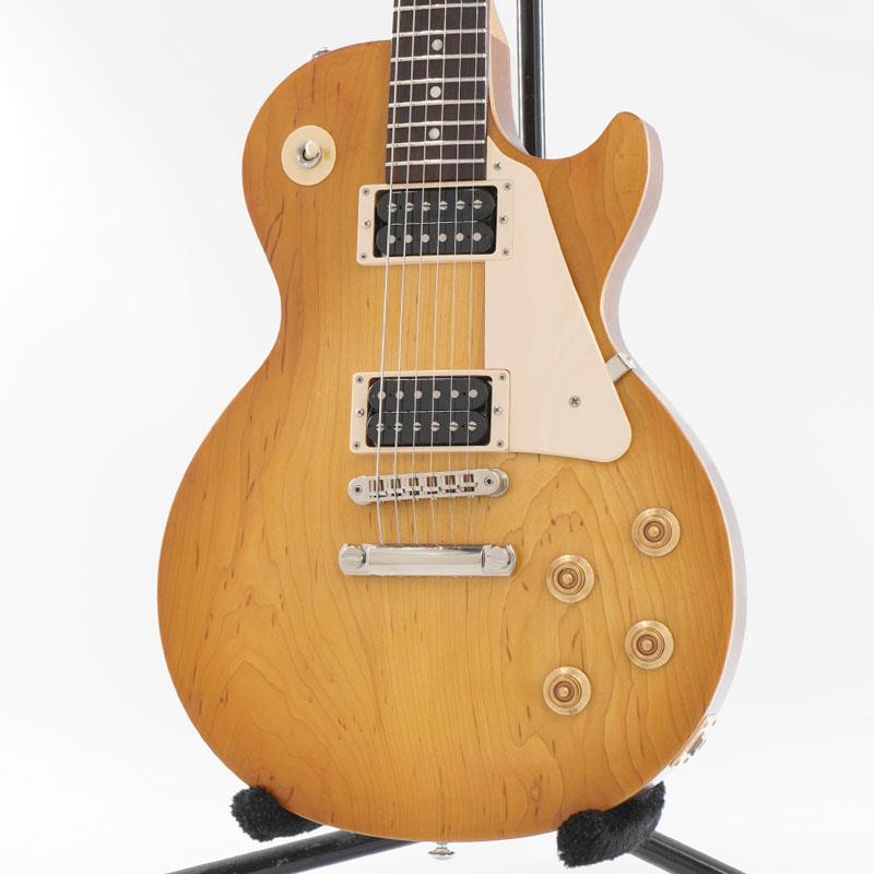 楽器種別：ユーズドGibson/Les Paul Models 商品一覧＞＞Gibson/ユーズド 商品一覧＞＞エレキギター【80，000円〜160，000円】 商品一覧＞＞レスポールタイプ/Gibson 商品一覧＞＞当店のギターは、出荷前に専門スタッフが検品・調整しているので安心です！Gibson USED 中古 Les Paul Tribute 2019 Grover Peg Modified (Satin Honeyburst) [SN. 190010978]商品説明お勧め中古品！Gibson USA Les Paul Tributeがお勧め中古品で入荷！2019年製です。ペグをGroverに交換したモデファイドモデルです。プレーンメイプルトップの木目にSatin Honeyburstがマッチする1本です！Gibson Les Paul Tribute古くからトップブランドとして君臨するギブソン。コストパフォーマンスに優れたレスポール・トリビュート！2019年製のお勧め中古の入荷です！低価格ながらも王道のギブソンサウンドを響かせることで人気を博す「レスポール・トリビュート」！ボディー、ネックのバインディングを廃したシンプルなスペック、サテンフィニッシュを採用することで温かみのある落ち着いた雰囲気の1本となっております。ネックはメイプルになります。指板はローズウッドです。ボディーはウルトラモダーン・ウェイトリリーフが施されてはいますが、ウッドマテリアルは伝統的なレスポール仕様。リピックアップにはアル二コIIマグネットを使用したオープン・タイプの490ハムバッカー・ピックアップが2基マウントされており、クラシカルな50年代的なトーン、パワー、そしてサスティンをもたらしています。今回、お勧め中古品が入荷です！前述のようにペグはオリジナルのVintage Deluxe w/ Keystone ButtonsからGroverに交換したモデファイドモデルです。よりピッチの安定感のなる実践的な仕様となっております！ネジ穴は空いたままになっております。オリジナルのペグは付属しておりません。トラスロッドカバーは無地のものに交換されております。（オリジナルのTributeのロゴ入りトラスロッドカバーは付属しております。）他には細かいスリ傷やピックガードの弾き傷と少し削れた傷、パーツのくすみは見受けられますが、全体的にはまずまずのコンディションの一本です！当店にてフルメンテナンスとクリーニングを施しておりますので、すぐにご使用頂けます！フロント/リアのボリュームノブの内部にクラックも見受けられますが、現状の動作には支障問題はございません。フレットもすぐにお使い頂けます。ほとんど残っております。ナットも問題ございません。トラスロッドも通常の調整に問題ございません。6弦側の13フレットの指板サイドの角が少しえぐれておりますが、プレイアビリティに支障、問題ございません。電装系もフルチェックしておりますので、動作に問題ございません。ウェイトは約3.88kgです。芯のあるサウンドをご堪能頂けるバランスです。付属品はオリジナル・ブラウン・ギグケース、Tributeのロゴ入りトラスロッドカバーになります。是非、この機会をお見逃し無く！SN. 190010978Weight≒3.88kg付属品　オリジナル・ブラウン・ギグケース、Tributeのロゴ入りトラスロッドカバー。商品詳細BodyBody Material: MahoganyTop Material: MapleWeight Relief: Ultra-ModernFinish: Satin Nitrocellulose LacquerNeckNeck Material: MapleNeck Profile: RoundedScale Length: 24.75 / 62.865cmFingerboard Material: RosewoodFingerboard Radius: 12 / 304.8mmNumber of Frets: 22Frets: Medium JumboNut Material: Graph TechNut Width: 1.695 / 43.05mmEnd-of-Board Width: 2.26 / 57.4mmInlays: Acrylic TrapezoidsHardwareFinish: NickelBridge: Aluminum Nashville Tune-O-MaticTailpiece: Aluminum Stop BarTuners: Grover Modified Pick Guard: CreamControl Knobs: Gold Top HatsSwitch Tip: CreamSwitch Washer: Cream (Not Mounted)Jack Plate: CreamElectronicsNeck Pickup: 490RBridge Pickup: 490TControls: 2 Volumes， 2 Tones & Toggle Switch※当店の取り扱い商品は中古の1点限りのご用意となります為、誠に勝手ながらご注文のお客様優先でのご案内とさせて頂きます。お問い合わせやお取置きのご依頼の際は予めご了承下さいますようお願い致します。イケベ楽器店Website以外の商品ページをご覧のお客様は、「取扱店舗の商品ページを見る」または「楽器店の購入ページへ」よりご注文下さい。イケベカテゴリ_エレキギター_レスポールタイプ_Gibson_Les Paul Models_ユーズド SW_Gibson_ユーズド JAN:2500010914802 登録日:2026/08/20 エレキギター ギブソン レスポール