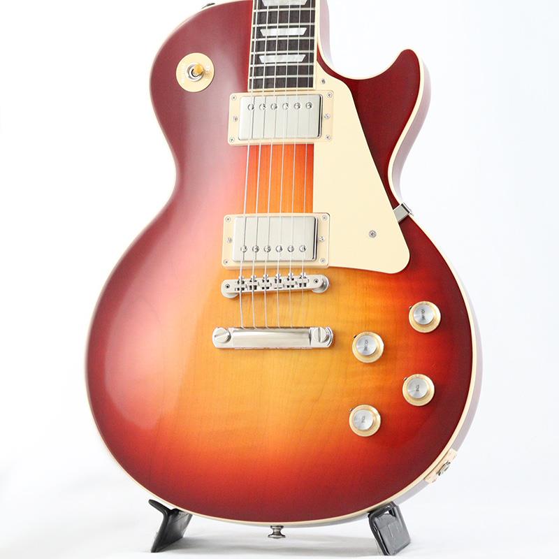 楽器種別：新品Gibson/Les Paul Models 商品一覧＞＞Gibson/新品 商品一覧＞＞エレキギター【230，000円〜435，000円】 商品一覧＞＞レスポールタイプ/Gibson 商品一覧＞＞当店のギターは、出荷前に専門スタッフが検品・調整しているので安心です！Gibson USA Exclusive Les Paul Standard '60s AAA Figured Top (Dark Cherry Sunburst) [SN.216150014]商品説明Gibson Nashville Summit 2025 現地選定品！本国の大手ディーラーオーダーによるUSA国内限定品。AAAグレードトップ、カタログ外カラーが採用されたLes Paul Standard '60s！！コチラは、AAAフィギュアード・メイプルトップやDark Cherry Sunburstカラーを採用したUSA国内限定モデルです。ウエイトリリーフを施さないソリッドボディに、握りやすいスリムテーパーのネックをジョイント。キャビティはトラディショナルモデルと同様に、基盤を使わず配線されており、コンデンサーはオレンジドロップが使われております。サウンドの要であるピックアップには、レギュラーモデルのLes Paul Standard '60sとは異なり60s Burstbuckerを搭載。ややブライトなクラシック・ハムバッキング・トーンでパワーとトップエンドを強調したクラシカルなボイスを実現しております。ギブソン王道のロックサウンドを求めるギタリストには是非ともオススメの1本です。是非この機会をお見逃しなく！商品詳細Weight≒4.24kgBodyMaterial: MahoganyTop: AAA Figured MapleWeight Relief: NoneNeckNeck: MahoganyProfile: Slim TaperNut width: 1.695 / 43.05mmFingerboard: RosewoodScale length: 24.75 / 628.65mmNumber of frets: 22Nut: Graph TechInlay: Acrylic TrapezoidsHardwareBridge: ABR-1 Tune-O-MaticKnobs: Gold Top Hats with Silver Reflector & PointersTuners: Grover Rotomatics w/ Kidney ButtonsPlating: NickelElectronicsNeck pickup: 60s BurstbuckerBridge pickup: 60s BurstbuckerControls: 2 Volumes， 2 Tones & Toggle Switch (Hand-wired with Orange Drop Capacitors)ハードケース付属イケベカテゴリ_エレキギター_レスポールタイプ_Gibson_Les Paul Models_新品 SW_Gibson_新品 JAN:4570156017208 登録日:2025/12/09 エレキギター ギブソン レスポール