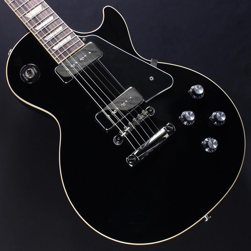 楽器種別：アウトレットGibson/Les Paul Models 商品一覧＞＞Gibson/アウトレット 商品一覧＞＞エレキギター【230，000円〜440，000円】 商品一覧＞＞レスポールタイプ/Gibson 商品一覧＞＞当店のギターは、出荷前に専門スタッフが検品・調整しているので安心です！Gibson Noel Gallagher Les Paul Standard (Ebony) #212760021【2ND特価】商品説明※本商品は傷や一部塗装不良などがある2NDアウトレット品になります。そのため、保証内容につきましては演奏に関わる部分のみであり、外観については対象外となります。あらかじめご了承ください。Noel Gallagher Les Paul StandardCelebrating the biggest rock'n'roll reunion of recent times近年最大のロックンロール・バンドの再結成を記念して、ギブソンは2025年最も話題を呼んだギターをリリースできることを誇りに思います。期間限定販売となるNoel Gallagher Les Paul Standardは、ノエル自身が『Live ’25』ツアーのために特別にデザインしたモデルです。90年代のサウンド、ヴァイブ、スタイルを再現しつつ、現代のユーザーに向けて完全な形で蘇らせました。本モデルは、ウェイト・リリーフ（重量軽減）加工を施していないマホガニー・ボディにバウンド・メイプルキャップを採用。マホガニー・ネックにはノエル・ギャラガーが好むスリムテーパーネック・プロファイルを採用し、バウンド・ローズウッド指板には22ミディアム・ジャンボ・フレットとアクリル製のトラぺゾイド・インレイを施しています。ハードウェアにはABR-1 Tune-0-Matic ブリッジとアルミニウム製ストップバー・テールピースを採用しており、正確なイントネーション調整と優れたサステインを実現します。さらに、スムーズなチューニング精度を誇るGroverRotomaticチューニングマシン（キドニーボタン付き）を採用、クローム製スイッチワッシャー、アウトプット・ジャックプレートも装備しています。ピックガードは、レスポール・カスタムに使用されるタイプと同様のブラックの5プライ・スタイルを採用しています。エレクトロニクスも特徴的で、クロームカバーを施した独自のギブソンP-90ソープバー・ピックアップは個別にボリューム/トーンコントロールへハンドワイヤリングされ、3ウェイピックアップ・セレクターを備えています。コントロール・ノブはシルバー・リフレクターとダイヤル・ポインター付きのブラック・トップハットを使用しています。ヘッドストック裏面にアーティストのサインを再現したデカールが施され、ハードシェルケースが付属しており、あらゆる場面で安全に持ち運べます。Noel Gallagher Les Paul Standardは、歴史的な「Live ’25」ツアーを完璧に体現したモデルであり、新たな伝説となるLive ’25ツアーを象徴するファン必携のモデルです。商品詳細BodyShape: Les PaulBody Material: MahoganyBody Top: MapleBinding: Single Ply， Top and FretboardNeckNeck Material: MahoganyProfile: Slim TaperNut width: 1.695 / 43.053mmFingerboard: RosewoodScale length: 24.75 / 628.65mmNumber of frets: 22Nut: Graph TechInlay: Acrylic TrapezoidHardwareBridge: ABR-1 Tune-O-MaticTailpiece: Aluminum Stop BarTuners: Grover Rotomatic with Kidney ButtonControl Knobs: Black Top Hat with Silver Reflector and Dial PointerPlating: ChromeElectronicsNeck Pickup: Soapbar P-90Bridge Pickup: Soapbar P-90Controls: 2 Volume， 2 Tone， Hand-wired with Orange Drop Capacitors約4.20kgハードケース付属イケベカテゴリ_エレキギター_レスポールタイプ_Gibson_Les Paul Models_アウトレット SW_Gibson_アウトレット JAN:2500010924603 登録日:2026/09/14 エレキギター ギブソン レスポール