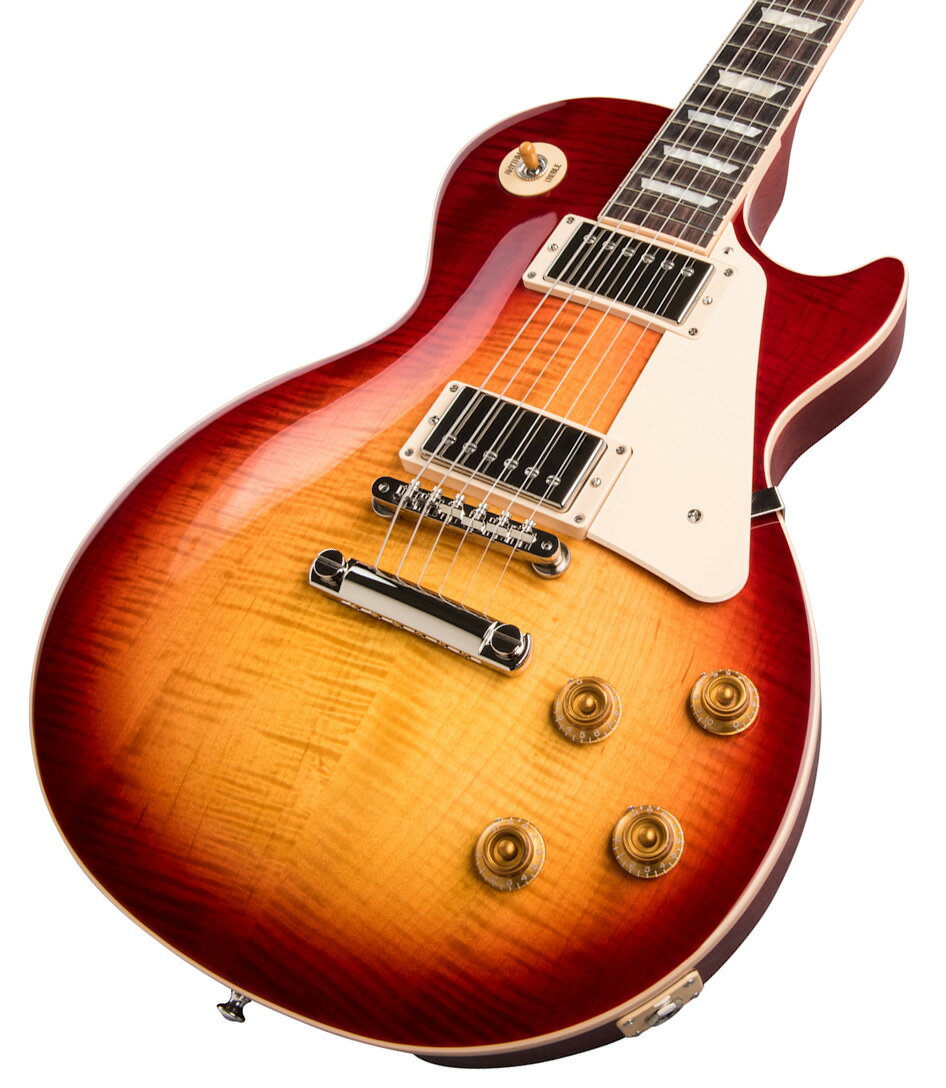 50s Les Paul Standardがパワーアップして登場！ 全世界待望の50s Les Paul Standardがパワーアップして登場！ Gibson 50s Les Paul Standard 、メイプルトップにウエイトリリーフを廃したマホガニーボディ、50年代の丸みを帯びたネックを採用した往年のレスポールスタンダードを求めるプレイヤーに最適な一本です。 ピックアップには定評のあるBurstbucker 1(Neck)/Burstbucker 2(Bridge)を搭載し、左手の細かなニュアンスやピッキングの強弱、繊細なボリュームコントロールといった演奏表現を余さず出力します。 近年のギブソンに見られる基盤でなく、ハンドワイヤードの電装にはオレンジドロップキャパシターを搭載！ キーストーンペグ、ワイヤーなしのABRブリッジにアルミニウム製ブリッジ・テイルピースなど、ヴィンテージを意識した拘りが満載でございます。 使い込むほどに手に馴染み、より一層オールド感が引き立つ至極の一本となるでしょう！ 付属品：ハードケース、Gibsonユーザー登録カード ※お届けにお時間を要する場合には別途お知らせいたします。 ご購入後、同梱されるユーザー登録カードに必要事項をご記入の上、ギブソン・ジャパンへご郵送ください。 ユーザー登録したご本人様に限り、メーカー規定の故障に対して無期限での保証が提供されます。 ■保証:1年 ※こちらの商品画像はサンプルです。 複数のモールに掲載されているため、売却に伴う商品情報の削除は迅速を心掛けておりますが必ずしもリアルタイムではございませんので、ご注文後に万一売り切れとなっておりました際は誠に申し訳ございませんがご容赦くださいませ。 ブリッジに使用されているABRは現在アジャスタブルスタイルの仕様に変更される過渡期となっており、使用されているパーツは混在しております。予めご了承くださいませ。 製品仕様 Neck MaterialMahoganyNeck ProfileVintage 50sScale Length24.75"Fingerboard MaterialRosewoodFingerboard Radius12"Number Of Frets22FretsMedium JumboNut MaterialGraph TechNut Width1.695"End of Board Width2.26"InlaysAcrylic TrapezoidsBody MaterialMahoganyBody TopMapleWeightReliefNoneFinishGloss Nitrocellulose LacquerHardware FinishNickelBridgeABRTailpieceAluminum Stop BarPickguardCreamControl KnobsAmber Top Hats w/ PointersSwitch TipAmberSwitchwasherCreamJack Plate CoverCreamNeck PickupBurstbucker 1Bridge PickupBurstbucker 2Controls2 Volumes, 2 Tones & Toggle Switch &#40;Hand-wired with Orange Drop Capacitors&#41;Strings.010, .013, .017, .026, .036, .046CaseHard Shell Case