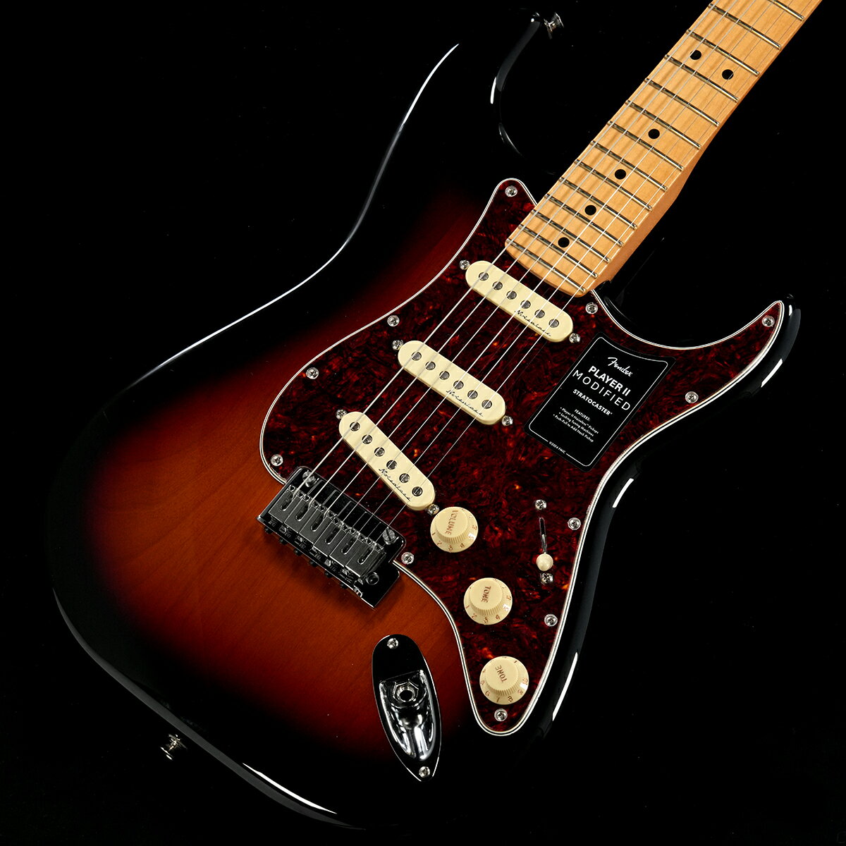 Player IIにアップグレードを施した『Player II Modified』 現代のギタリストやベーシストのための主要なアップグレードが施されたPlayer II Modifiedは、あなたのパフォーマンスを次のレベルに引き上げてくれる多用途な製品をラインアップしています。Player II Modified Stratocasterは、モダンプレイヤーを念頭に置いて設計されたクラシカルなギターです。Modern “C”ネックシェイプ、シルキーなサテンウレタンフィニッシュを施したネックバック、9.5インチラジアスのスラブローズウッドまたは1ピースメイプル指板、滑らかにロールオフ処理された指板エッジ、22本のミディアムジャンボフレットなど、ネックに注がれたすべてのディテールが、高速で流れるようなプレイアビリティをサポートします。アルダーボディはフェンダーらしいパンチのあるトーンが特徴で、様々な新しいカラーフィニッシュが用意されています。Player II Noiselessピックアップは、不要なノイズを抑制しながら、クラシックなストラトの煌びやかなトーンを奏で、トーン2ノブに備えられたプッシュ／プルスイッチ機能は、ピックアップポジション1と2が選択されている際にネックピックアップを有効にし、トーンの幅をさらに広げます。2点支持トレモロ、ショートポストロッキングチューナー、TUSQナット、モダンストリングツリーにより、驚異的なチューニングの安定性を実現します。面取りされたトレモロブロックの広い可変幅により、さらに表現力豊かで音楽的なビブラートを得ることが可能です。■付属品：デラックスギグバッグ、トレモロアーム、調整用レンチ、メーカー保証書■S/N:MX24105318■重量:3.76kg■JANコード:0885978396757■付属品:ソフトケース、メーカー保証書、トレモロアーム製品仕様Body Material AlderBody Finish Gloss PolyesterNeck Maple, Modern “C”Neck Finish Satin UrethaneFingerboard Maple, 9.5” (241 mm)Frets 22, Medium JumboPosition Inlays Black Dot (Maple)Nut (Material/Width) TUSQ, 1.650” (42 mm)Tuning Machines Deluxe Cast/Sealed Locking (all short posts)Scale Length 25.5” (64.77 cm)Bridge 2-Point Synchronized Tremolo with Block Saddles and Chamfered Tremolo BlockPickguard 4-Ply TortoiseshellPickups Player II Noiseless Strat (Bridge), Player II Noiseless Strat (Middle), Player II Noiseless Strat (Neck)Pickup Switching 5-Position Blade | Position 1. Bridge Pickup, Position 2. Bridge and Middle Pickup, Position 3. Middle Pickup, Position 4. Middle and Neck Pickup, Position 5. Neck PickupAuxiliary Switching Push/Pull Switch On Tone 2 Adds Neck PickupControls Master Volume with Treble-Bleed, Tone 1. (Neck/Middle Pickups), Tone 2. (Bridge Pickup)Control Knobs Aged White PlasticHardware Finish Nickel/ChromeStrings Fender USA 250L Nickel Plated Steel (.009-.042 Gauges), PN 0730250403Case/Gig Bag Included | Deluxe Gig Bag 製品仕様 Body Material AlderBody Finish Gloss PolyesterNeck Maple, Modern “C”Neck Finish Satin UrethaneFingerboard Maple, 9.5” (241 mm)Frets 22, Medium JumboPosition Inlays Black Dot (Maple)Nut (Material/Width) TUSQ, 1.650” (42 mm)Tuning Machines Deluxe Cast/Sealed Locking (all short posts)Scale Length 25.5” (64.77 cm)Bridge 2-Point Synchronized Tremolo with Block Saddles and Chamfered Tremolo BlockPickguard 4-Ply TortoiseshellPickups Player II Noiseless Strat (Bridge), Player II Noiseless Strat (Middle), Player II Noiseless Strat (Neck)Pickup Switching 5-Position Blade Auxiliary Switching Push/Pull Switch On Tone 2 Adds Neck PickupControls Master Volume with Treble-Bleed, Tone 1. (Neck/Middle Pickups), Tone 2. (Bridge Pickup)Control Knobs Aged White PlasticHardware Finish Nickel/ChromeStrings Fender USA 250L Nickel Plated Steel (.009-.042 Gauges), PN 0730250403Case/Gig Bag Included