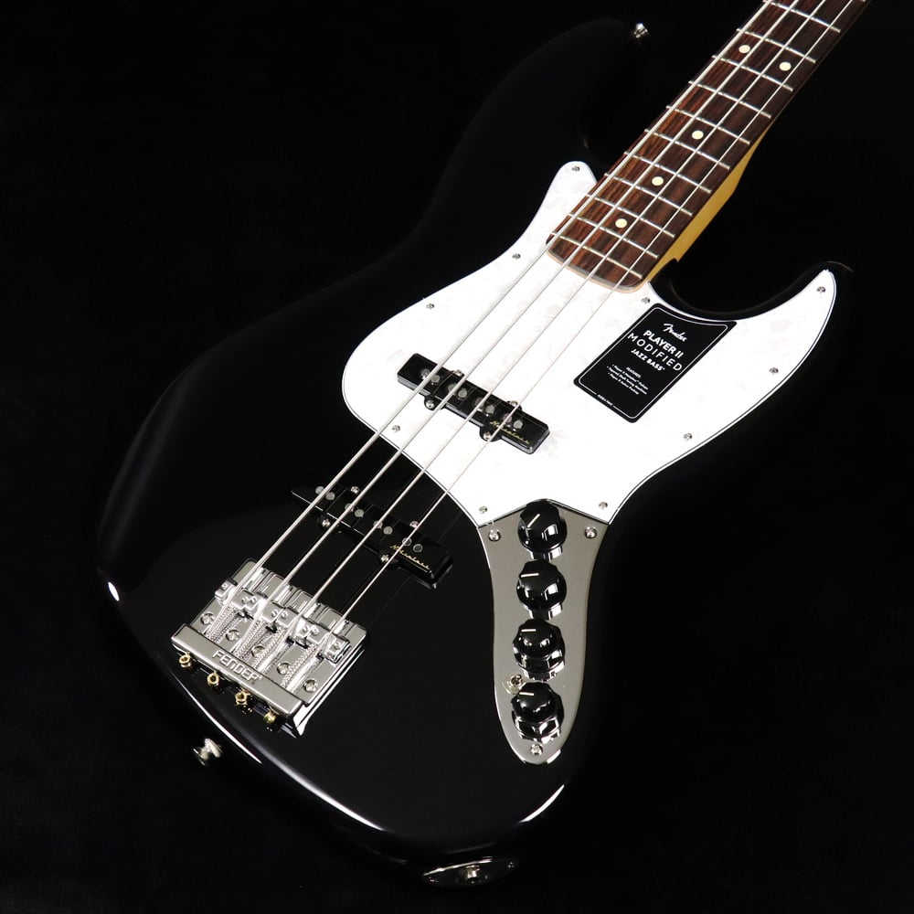 大人気のPlayer IIに様々なアップグレードを施した『Player II Modified』登場！現代のギタリストやベーシストのための主要なアップグレードが施されたPlayer II Modifiedは、あなたのパフォーマンスを次のレベルに引き上げてくれる多用途な製品をラインアップしています。Player II Modified Active Jazz Bassは、モダンプレイヤーを念頭に置いて設計されたクラシカルなベースです。Modern “C”ネックシェイプ、シルキーなサテンウレタンフィニッシュを施したネックバック、9.5インチラジアスのスラブローズウッドまたは1ピースメイプル指板、滑らかにロールオフ処理された指板エッジ、20本のミディアムジャンボフレットなど、ネックに注がれたすべてのディテールが、高速で流れるようなプレイアビリティをサポートします。アルダーボディはフェンダーらしいパンチのあるトーンが特徴で、様々な新しいカラーフィニッシュが用意されています。Player II Noiselessピックアップは、不要なノイズを抑制しながら、ジャズベースの唸るようなクラシックトーンを奏でます。さらに、全く新しいアクティブプリアンプは、アクティブ/パッシブのトーンコントロールとEQセクションを備え、プレイヤーが理想のサウンドを自在に調整できる完璧なツールです。4サドルHiMassブリッジ、テーパードシャフトチューニングマシン、TUSQナットにより、驚異的なチューニングの安定性を実現します。■付属品：デラックスギグバッグ、調整用レンチ、メーカー保証書 ■ 重量：4.48kg ■ JAN：0885978398959 ※こちらの商品は現物1点限りを、店頭展示を含め複数のモールに同時掲載しております。 売却に伴う商品情報の削除は迅速を心掛けておりますが、必ずしもリアルタイムではございません。 ご注文後に万一売り切れとなっておりました際は、誠に申し訳ございませんがご容赦くださいませ。 製品仕様 ModelPlayer II Modified Active Jazz Bass Rosewood Fingerboard DuskBody MaterialAlderBody FinishGloss PolyesterNeckMaple, Modern “C”Neck FinishSatin UrethaneFingerboardRosewood, 9.5” &#40;241 mm&#41;Frets20, Medium JumboPosition InlaysWhite Dot &#40;Rosewood&#41;Nut Material/WidthTUSQ, 1.5” &#40;38.1 mm&#41;Tuning MachinesTapered-Shaft Open-GearScale Length34” &#40;86.36 cm&#41;BridgeFender HiMass with Chrome-Plated Zinc SaddlesPickguard4-Ply White PearloidPickupsPlayer II Noiseless Jazz Bass &#40;Bridge&#41;, Player II Noiseless Jazz Bass &#40;Middle&#41;Pickup SwitchingPan PotAuxiliary SwitchingActive/Passive Toggle SwitchControlsMaster Volume, Pan Pot &#40;Pickup Selector&#41;, Treble Boost/Cut, Midrange Boost/Cut, Bass Boost/Cut, Active/Passive Tone, Active/Passive Mini ToggleControl KnobsBlack PlasticHardware FinishNickel/ChromeStringsFender USA 7250M Nickel Plated Steel &#40;.045-.105 Gauges&#41;, PN 0737250406Case/Gig BagIncluded