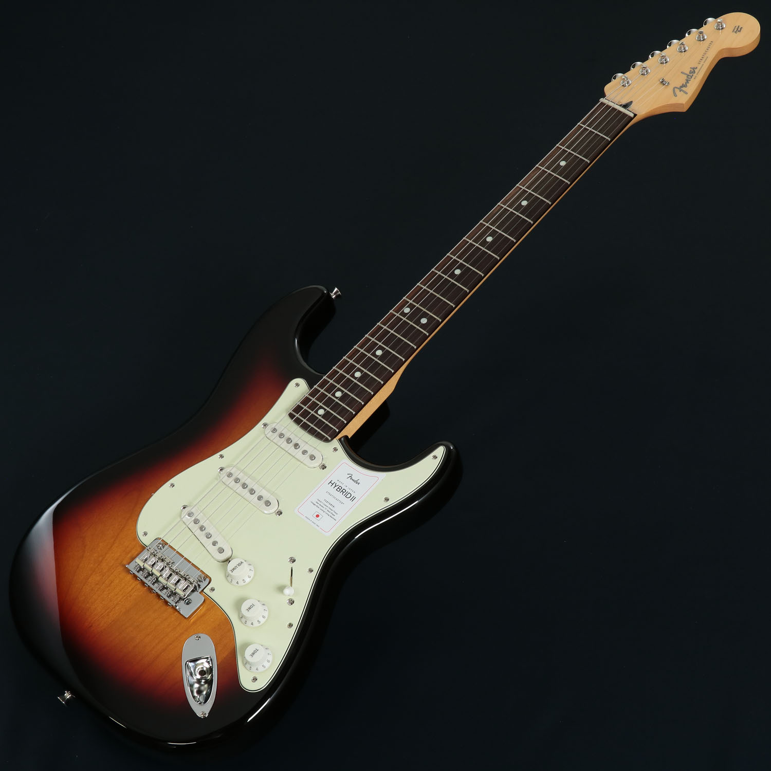 イシバシ楽器池袋店限定キャンペーン 新品Fenderエレキギター対象製品（SQUIERブランド及びアコースティックを除く）をお求めいただくと、 『Elixir / NANOWEB with ANTI-RUST #12002 Super Light 09-42』x 3セットがついてくる！ キャンペーンの対象となる商品はこちらのバナーが目印です。 ※数量限定のため、キャンペーンは予告無く終了する場合がございます。 ---------------------------------- フェンダー日本製『Made in Japan Hybrid II』登場！ Made in Japan Hybrid IIは、ヴィンテージなルックスはそのままに、プレイヤーや音楽のジャンルを選ばないオールマイティーなモダンスペックを盛り込んだ、まさに「ハイブリッド」と呼ぶにふさわしいシリーズです。 リズム/リード問わず、どのギタリストやベーシストにもフィットする演奏性と楽器のトーンを兼ね備えた製品を、世界的にファンの多いMadein Japanで実現しました。 Hybrid II Stratocasterは、定評あるアルダーボディに新設計のHybrid II Custom Voiced Single Coilピックアップを装備し、ヴィンテージスタイルサドル付きの2点支持トレモロシステムを搭載。 ヴィンテージロッキングチューナー、Modern “C”シェイプにサテンフィニッシュのネック、9.5インチラジアスの指板とナロートールフレットがスムーズなプレイヤビリティを提供します。 ■付属品：ソフトケース、トレモロアーム、メーカー正規保証書 主な仕様 Body Material: Alder Body Finish: Gloss Polyurethane Neck: Maple, Modern “C” Neck Finish: Satin Urethane Finish on Back, Gloss Urethane Finish on Front Fingerboard: Maple or Rosewood, 9.5” (241 mm) Frets: 22, Narrow Tall Position Inlays: Black Dot (Maple), White Dot (Rosewood) Nut (Material/Width): Bone, 1.650” (42 mm) Tuning Machines: Vintage-Style Locking Scale Length: 25.5” (648 mm) Bridge: 2-Point Synchronized Tremolo with Vintage-Style Stamped Steel Saddles Pickguard: 3-Ply Eggshell 318, 367), 4-Ply Tortoiseshell (306, 307) Pickups: Hybrid II Custom Voiced Single Coil Stratocaster (Bridge), Hybrid II Custom Voiced Single Coil Stratocaster (Middle), Hybrid II Custom Voiced Single Coil Stratocaster (Neck) Pickup Switching: 5-Position Blade: Position 1. Bridge Pickup, Position 2. Bridge and Middle Pickup, Position 3. Middle Pickup, Position 4. Middle and Neck Pickup, Position 5. Neck Pickup Controls: Master Volume, Tone 1. (Neck Pickup), Tone 2. (Bridge/Middle Pickup) Control Knobs: Eggshell Hardware Finish: Nickel/Chrome Strings: Nickel Plated Steel (.009-.042 Gauges) Case/Gig Bag: Gig Bag