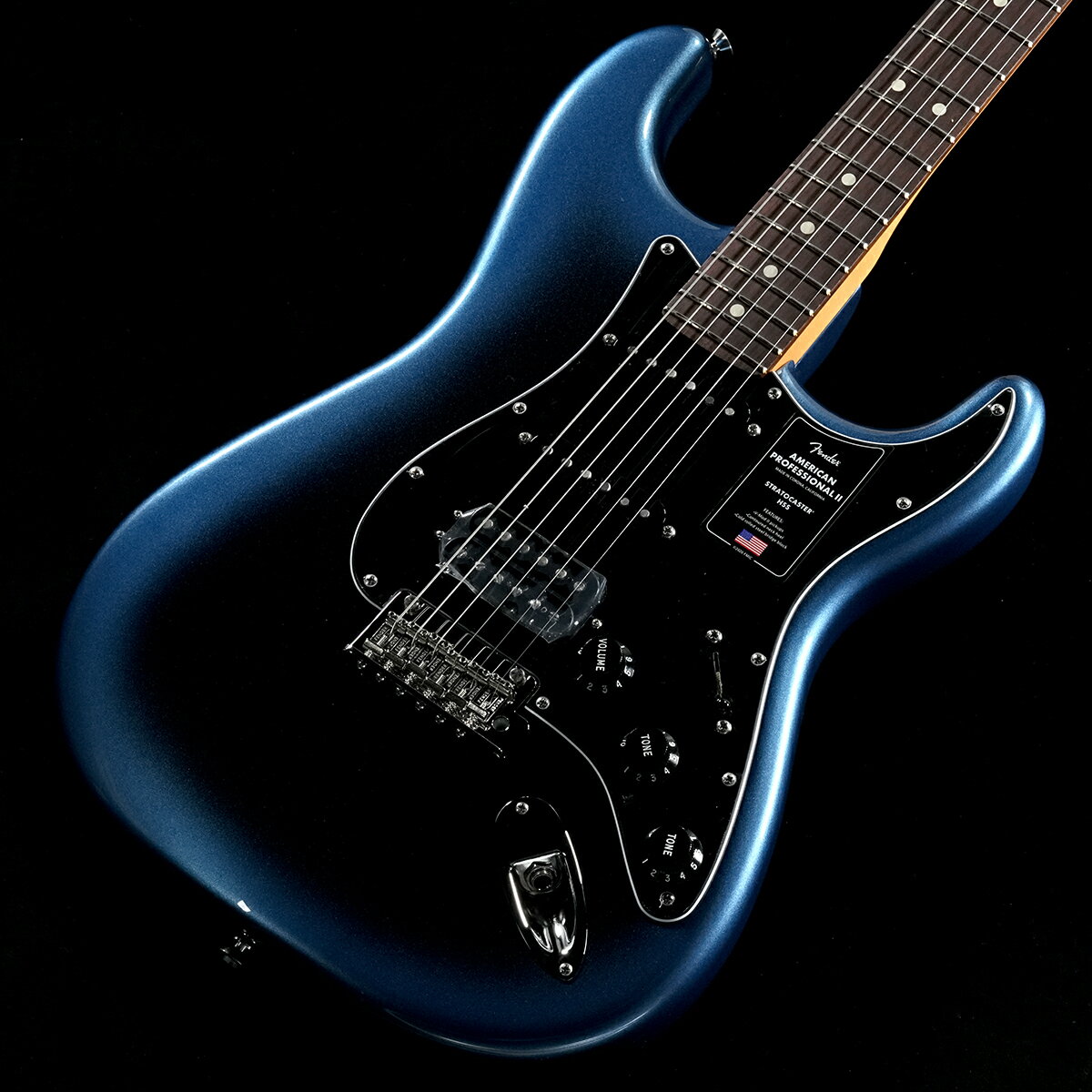 プロアマ問わず大人気のUSA製フェンダー、アメプロがパワーアップして登場！American Professional II Stratocaster HSSは、60年以上に渡る革新、インスピレーション、進化を経て、現代のプレイヤーの要求に応えます。高い人気を誇るDeep Cシェイプネックは、丁寧にエッジがロールオフされ、至高の演奏体験を約束する"Super-Natural"サテン仕上げが施されています。また新たに設計されたネックヒールを採用し、快適なフィーリングとハイポジションへの容易なアクセスを実現しました。新しいV-Mod II Stratocaster Single-Coilピックアップは、ベルのような輝きとウォームさを両立し、これまで以上に繊細で魅力的なサウンドを実現しています。Double Tapブリッジピックアップはパンチのあるトーンと、Push-Push式コントロールによりバランスの取れたシングルコイルトーンに瞬時に切り替え可能です。コールドロールド（冷間圧延成型式）スチールブロックを採用した2点支持トレモロは、サスティン、明瞭度、ハイエンドの煌びやかさを向上させています。American Professional II Stratocaster HSSの手に馴染む感覚とサウンドの多様性は、手に取り、耳にした瞬間、すぐにお分かりいただけることでしょう。プロの楽器の新たなスタンダードとなるような幅広い改良が、American Professional IIシリーズには詰め込まれています。■付属品：トレモロアーム、レンチ、ハードケース、メーカー正規保証書■保証:2年※画像はサンプルです。複数のモールに掲載されているため、売却に伴う商品情報の削除は迅速を心掛けておりますが必ずしもリアルタイムではございませんので、ご注文後に万一売り切れとなっておりました際は誠に申し訳ございませんがご容赦くださいませ。■S/N:US25064050■重量:3.79kg■JANコード:0885978578818■付属品:トレモロアーム、レンチ、ハードケース、メーカー正規保証書 製品仕様 Body Material BasswoodBody Finish Satin UrethaneNeck Maple, Rei Original “C”Neck Finish Satin Urethane Finish on Back, Gloss Urethane Finish on FrontFingerboard Rosewood, 7.25” &#40;184.1 mm&#41;Frets 24, Narrow TallPosition Inlays Pearl DotNut &#40;Material/Width&#41; Bone, 1.578” &#40;40 mm&#41;Tuning Machines Vintage-Style Locking Single Line “Fender Deluxe”Scale Length 25.5” &#40;64.77 cm&#41;Bridge 2-Point Synchronized Tremolo with Graph Tech SaddlesPickguard 3-Ply ParchmentPickups Vintage Noiseless Single-Coil Strat &#40;Bridge&#41;, Vintage Noiseless Single-Coil Strat &#40;Middle&#41;, Vintage Noiseless Single-Coil Strat &#40;Neck&#41;Pickup Switching 5-Position Blade Controls Master Volume, Tone 1. &#40;Neck Pickup&#41;, Tone 2. &#40;Middle Pickup&#41;Control Knobs Aged WhiteHardware Finish Nickel/ChromeStrings Nickel Plated Steel &#40;.009-.042 Gauges&#41;Case/Gig Bag Included