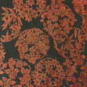 【中古】黒色地に朱色の花輪紋の大島紬はぎれ