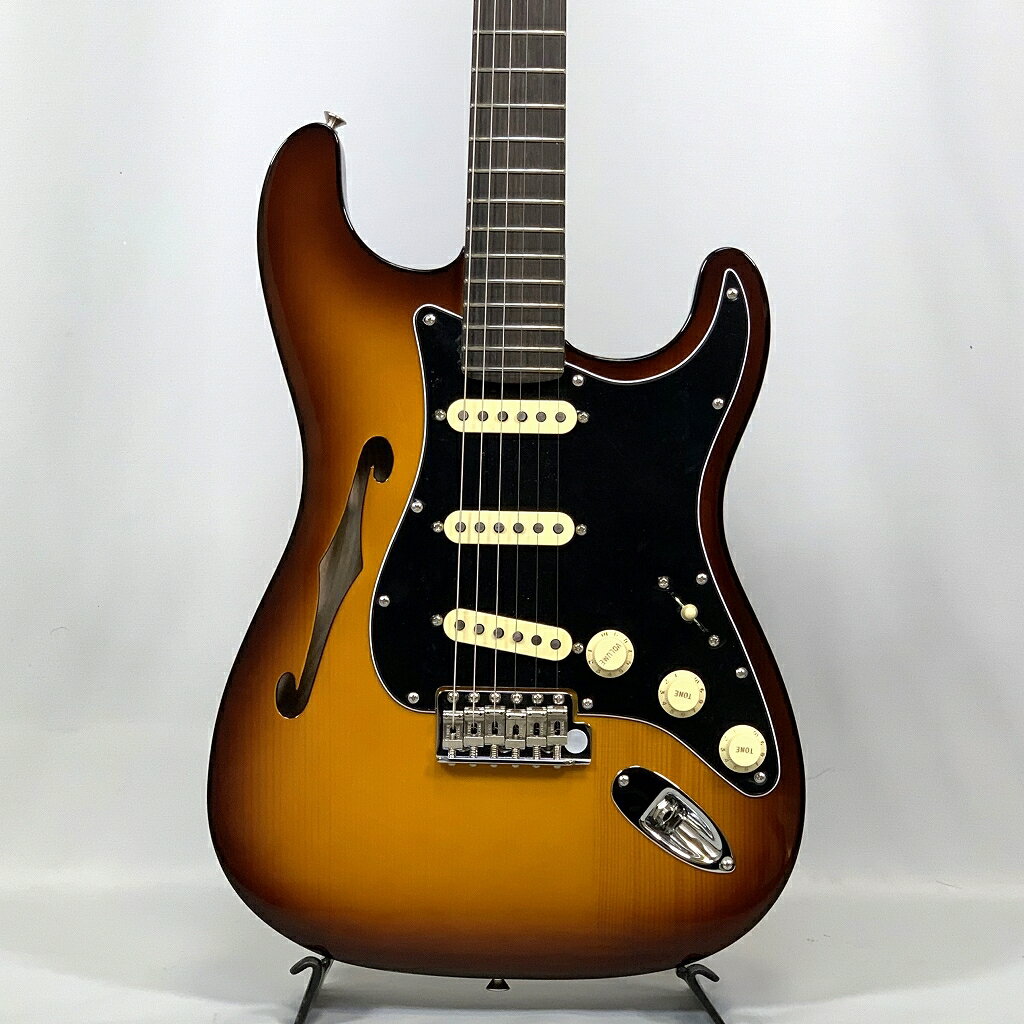 Fender Limited Edition Suona Stratocaster Thinline 音楽的なインスピレーションと、魅力的なデザインを備えたSuona Stratocaster® Thinlineは、伝説的なギター職人の卓越したクラフトマンシップを反映した、洗練されたエレガンスを纏っています。伝統的なフェンダーデザインを取り入れ、温かいトーンと比類のない美しさは、細部にまで注がれたこだわりと芸術性を証しするものです。 セミホロウアッシュボディに、イタリアンアルパインスプルーストップを組み合わせたこの楽器は、クリアで生き生きとした響きに加え、Thinlineならではのアコースティックな温かみを誇ります。Modern "C"シェイプのローストフレームメイプルネックと7.25～9.5インチコンパウンドラジアス仕様のエボニー指板は、贅沢な弾き心地と卓越した演奏性を提供し、ヴィンテージスタイルのシンクロナイズドトレモロはフェンダーならではのピュアなトーンとパフォーマンスを提供します。カスタムデザインのSuonaブリッジピックアップとCustom Shop '69ピックアップのコンビネーションが、ダイナミックで表現力豊かなトーンを生み出し、プレミアムなニトロセルロースラッカーバイオリンバーストフィニッシュとマッチングヘッドストックが、時代を超えた美しい楽器に仕立て上げています。 [ 特長 ] ・イタリアンアルパインスプルーストップのセミホロウアッシュボディ ・ニトロセルロースラッカーバイオリンバーストフィニッシュとマッチングヘッドストック ・Custom Shop '69とカスタムデザインのSuona Strat®ピックアップ ・Modern “C”シェイプのローストフレームメイプルネック ・7.25～9.5インチコンパウンドラジアス仕様のエボニー指板 ・ヴィンテージスタイルシンクロナイズドトレモロ Fender Limited Edition Suona Stratocaster Thinline Specs Body Body Material: Semi-Hollow Ash with Italian Alpine Spruce Top Body Finish: Gloss Nitrocellulose Lacquer Body Shape: Stratocaster® Body Binding: Single-Ply Black Top Binding Neck Neck Material: Roasted Flame Maple Neck Construction: 4-Bolt Standard Neck Finish: Satin Nitrocellulose Lacquer with Matched Headcap Neck Shape: Modern "C" Scale Length: 25.5" (64.77 cm) Fingerboard Material: Ebony Fingerboard Radius: 7.25" to 9.5" Vintage Compound Radius (184 mm to 241 mm) Number of Frets: 22 Fret Size: Narrow Tall Nut Material: Bone Nut Width: 1.685" (42.8 mm) Position Inlays: None Side Dots: White Truss Rod: Head Adjust Truss Rod Nut: 1/8" Hex Adjustment Electronics Bridge Pickup: Custom-Designed Suona Single-Coil Strat® Middle Pickup: Custom Shop '69 Strat® Single-Coil Neck Pickup: Custom Shop '69 Strat® Single-Coil Controls: Master Volume, Tone 1. (Neck/Middle Pickups), Tone 2. (Bridge Pickup) Switching: 5-Position Blade: Position 1. Bridge Pickup, Position 2. Bridge and Middle Pickup, Position 3. Middle Pickup, Position 4. Middle and Neck Pickup, Position 5. Neck Pickup Configuration: SSS Hardware Bridge: 6-Saddle Vintage-Style Synchronized Tremolo with Bent Steel Saddles Hardware Finish: Nickel/Chrome Tuning Machines: Pure Vintage Single Line "Fender Deluxe" Pickguard: 3-Ply Black/White/Black Control Knobs: Aged White Plastic Switch Tip: Aged White Neck Plate: 4-Bolt with Custom Suona Logo Miscellaneous Strings: Fender® USA 250L Nickel Plated Steel (.009-.042 Gauges), PN 0730250403 Accessories Case/Gig Bag: Deluxe Blonde Hardshell ★掲載の商品は店頭や他のECサイトでも並行して販売しております。在庫情報の更新には最大限の努力をしておりますが、ご注文が完了しましても売り切れでご用意できない場合がございます。 　また、お取り寄せ商品の場合、生産完了・メーカー価格改定などの理由でご用意できない場合がございます。 　その際はご注文をキャンセルさせていただきますので、予めご了承くださいませ。 ★お届け先が北海道や沖縄、その他離島の場合、「送料無料」と表記の商品であっても別途中継料や送料を頂戴いたします。その際は改めてご連絡を差し上げますのでご了承ください。