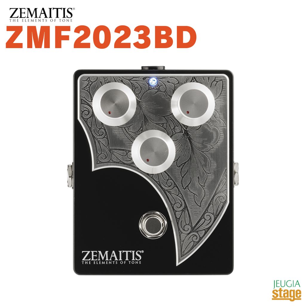 ZEMAITIS ZMF2023BD ゼマイティスより、ベース用ハンド・メイド・オーバードライヴ「ZMF2023BD」が登場しました。 ZMF2023BDは、ゼマイティスを代表するメタル・フロント・ベースのイメージを投入し、曲線を生かした形状の贅沢な彫金の入ったアルミ合金のプレートをトップに装飾したコンパクト・エフェクターです。 マット・ブラック・カラーのケースは、堅牢なアルミ合金の筐体で、数々の有名エフェクターでも採用されているハモンド製を用いています。 コントロール・ノブは、ゼマイティスで使用しているメタル製のハット・ノブを採用することで、エフェクターでありながら、メタル・フロント・ベースをイメージしたデザインとなっています。 ZMF2023BDは、伝統的なロックで聴き慣れた1970年代の大型チューブ・アンプをナチュラル・ドライヴさせたサウンドをイメージし、ナチュラルな歪みから現代的な激しい歪みサウンドまで網羅した幅広く使い勝手の良いベース・オーバードライヴを目指しました。 どれだけ歪ませても、低音が失われず骨太なトーンを実現しています。 加えて、1990年代に高い評価を得たハンドメイド・エフェクター・ブランドの「D.N.A. ANALOGIC」の設計者の協力を得て開発しています。 トーン・コントロールはSW- TONE SYSTEM（スイッチトーン・システム)を採用し、コントロールを絞り切ることでトーンのバイパスが可能です。 トーンをバイパスさせることで、エッヂのあるサウンドとなり、スラップ向けのサウンドや現代的で過激なベース・ドライヴとしても使用できます。 どのような使い方でも驚くほど太く抜けの良いサウンドが特長です。 また、丁寧な手作業によるパーツの取付け、配線、ケース加工など日本国内で製作をしています。 永年愛用していただけるように、耐久性を兼ね備えた製品作りを目指し、音質劣化が少なく、なおかつエフェクト効果を充分に発揮するように設計しています。 ●SW-TONE SYSTEM（スイッチトーン・システム)とは、一般的なトーン回路は、コントロール位置がフルの状態であってもトーン用可変抵抗器への信号を完全に遮断出来ず、僅かに高音域にマスクがかかるという問題があります。 その問題をトーン用の可変抵抗器への信号をスイッチを用い完全に切断し、クリアーな音質確保を実現したシステムです。 ●アルミ・ダイキャスト・ボディー: 世界中の多くのエフェクターのケースとして長年の実績を誇るハモンド社製アルミ素材のケースを採用することにより、高い電気伝導性を実現し、音質にも優れています。 また、アルミ自体の硬度の高さに加え、ダイキャスト・ボディー(一体構造)を採用することによって、万ーの落下などの衝撃に対してもエフェクトの心臓部である基板へのダメージを最小限に抑えることができます。 加えて、バッテリー交換専用の蓋や外部突起を最小限に取り払うことで不用意な破損を防ぎ、ボディーはより一層の強度を実現しています。 ●基板: ノイズやいわゆる音やせを防止するために入力から出力までの回路設計は限りなく無駄を省き合理化し、ハンド・ワイヤリングで製造しています。 複雑な回路と無駄なバーツを廃し、極限まで箇素化した回路設計によって音質の向上はもちろんのこと、複雑な回路設計が原因で起こる故障を減少させる結果を生んでいます。 音質劣化や回路のロスが限りなく少なく、ノイズの少ないピュアなサウンドを提供します。 また、本機に使用している電解コンデンサーは、全てオーディオ用の高級電解コンデンサーです。 さらに、抵抗には金属皮膜抵抗を使用し、すべて精度の高いもの(±1%)としたことで個体による音質の差が起きにくい設計です。 ●メタル・プレート: ゼマイティスZMF2023BDの外観を大きく特徴付けているトップのアルミ合金製の彫金プレートは、ゼマイティス・ギターの伝統を継承したアイコンで、単なるプリントやペイントとは違った高級感と存在感を演出します。 ●コントロール・ノブ: 経年変化の起こりやすく、また破損しやすいプラスティック製のものは使用せず、高級感のあるヘヴィー・デューティーなメタル製のものを採用しています。 足元に置き使用する機会の多いコンパクト・エフェクターであるため、誤ってコントロール・ノブを踏んでしまった際にもプラスティック製のノブに比べ、破損の確率が大幅に削減されています。 また、メタル製のノブはアースの役割も果たしています。 ●スイッチ／LED／ジャック: ゼマイティスZMF2023BDには電子スイッチを使用せず、音質を重視した機械式スイッチを採用しています。 電子スイッチにはないクリック感覚が足裏からでも感じ取ることができます。 暗い場所でも視認性の良い青色LEDを採用しています。 インプットおよびアウトプット・ジャックは信頼性の高いスイッチクラフト製を採用しています。 ●バッテリー・スペース: ボディー裏面に4点ネジで留まっている裏蓋を開けるとバッテリー・スペースがあり、バッテリー・スナップに接続してバッテリーを格納する場所となっています。 バッテリー専用蓋などを設けないことで、破損を最小限に抑えています。 仕様 ●電源: 006P(9V) バッテリー/AC アダプター ●コントロールノブ: LEVEL, TONE, DRIVE(3 ポット) ●スイッチ: エフェクトON/OFF、機械式フットスイッチ×1 ●入出力端子: IN, OUT, DC 入力端子(DC9V) ●入力インピーダンス: 約1MΩ ●推奨出力負荷: 10kΩ以上 ●消費電流: 約20mA ●外形寸法: 94(W)×34(H)×119.5(D)mm ※突起物含まず。 ●最大外形寸法: 100(W)×49.2(H)×121.2(D)mm ※付属の脚ゴム含まず。 ●重量: 約300g ※電池含まず。 ※脚ゴム付属 ※乾電池は付属しません。 ※DC In適応プラグ・サイズ: 内径2.1mm / 外径5.5mm ※別売パワー・サプライの極性は必ずセンター・マイナスを使⽤して下さい。 ※推奨パワー・サプライはMusic WorksのDC0913Bとなります。 Made in Japan ※商品画像はサンプルです。 ★掲載の商品は店頭や他のECサイトでも並行して販売しております。在庫情報の更新には最大限の努力をしておりますが、ご注文が完了しましても売り切れでご用意できない場合がございます。 　また、お取り寄せ商品の場合、生産完了・メーカー価格改定などの理由でご用意できない場合がございます。 　その際はご注文をキャンセルさせていただきますので、予めご了承くださいませ。 ★お届け先が北海道や沖縄、その他離島の場合、「送料無料」と表記の商品であっても別途中継料や送料を頂戴いたします。その際は改めてご連絡を差し上げますのでご了承ください。